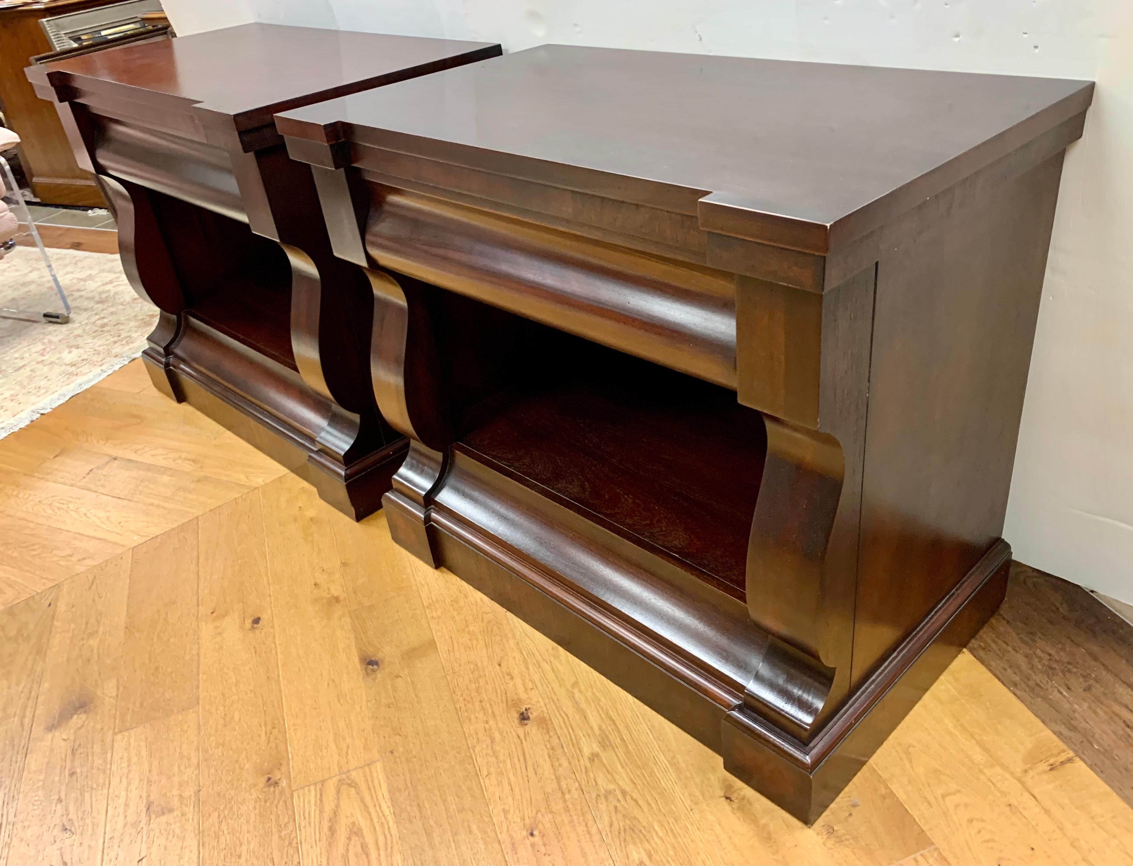 A pair of Ralph Lauren large mahogany empire style nightstands with one drawer and plenty of storage underneath. Beautifully crafted of solid wood makes the simplicity of these nightstands timeless in design and made to last for years to come.