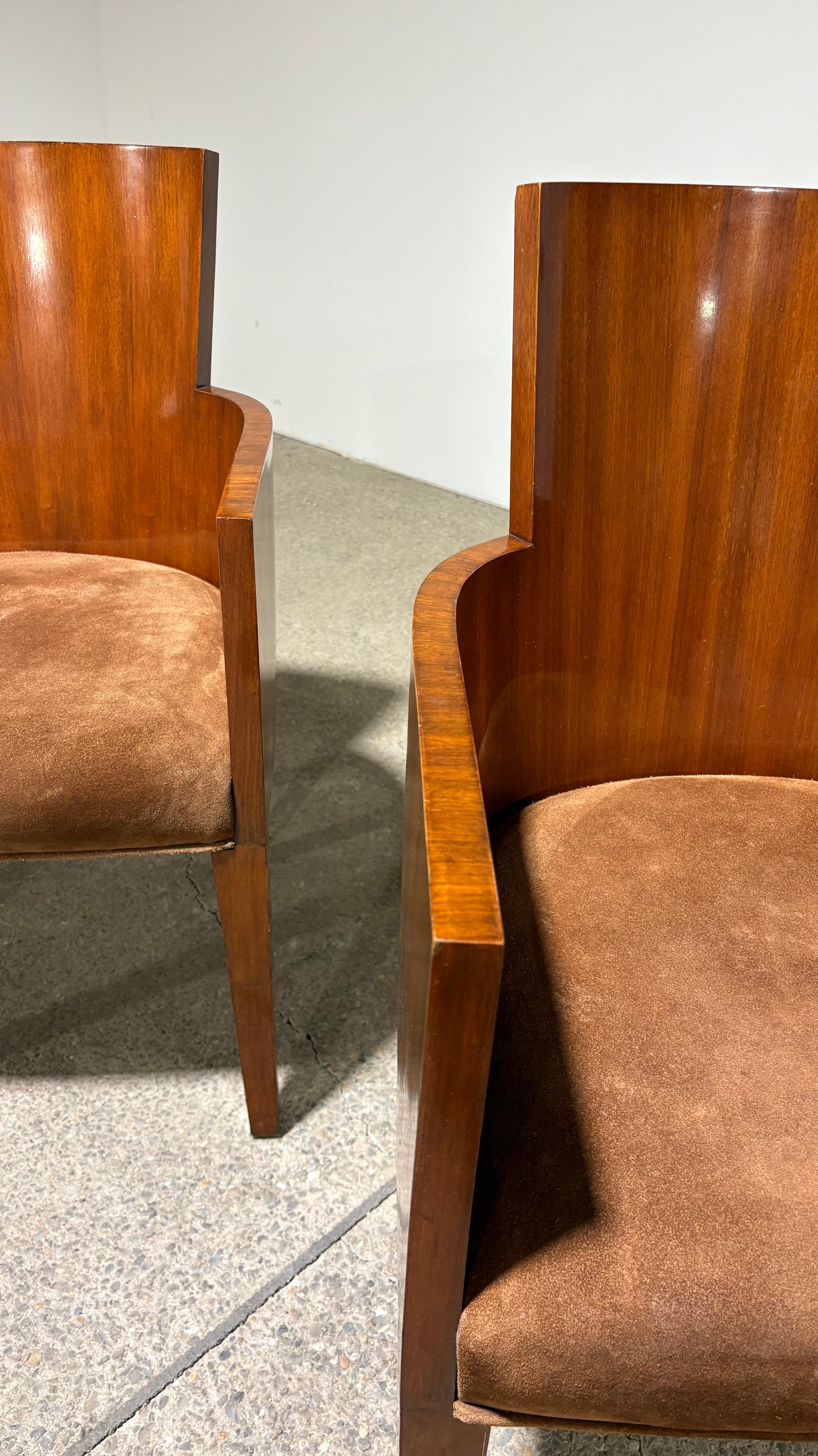 Stunning arm chairs made of alder wood and walnut veneer in the RL Hollywood Walnut finish. Seats are upholstered in brown suede. 

Perfect for a formal living room. 

Dimensions 22