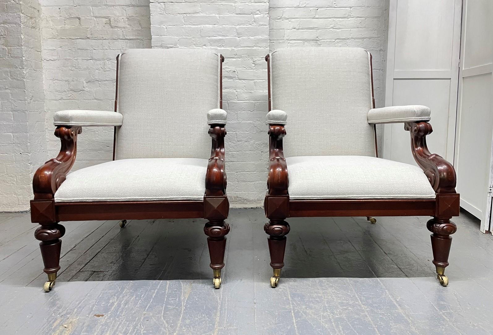 Pair of Ralph Lauren Upholstered Lounge Chairs. The chairs have solid mahogany frames, brass casters and are newly upholstered.