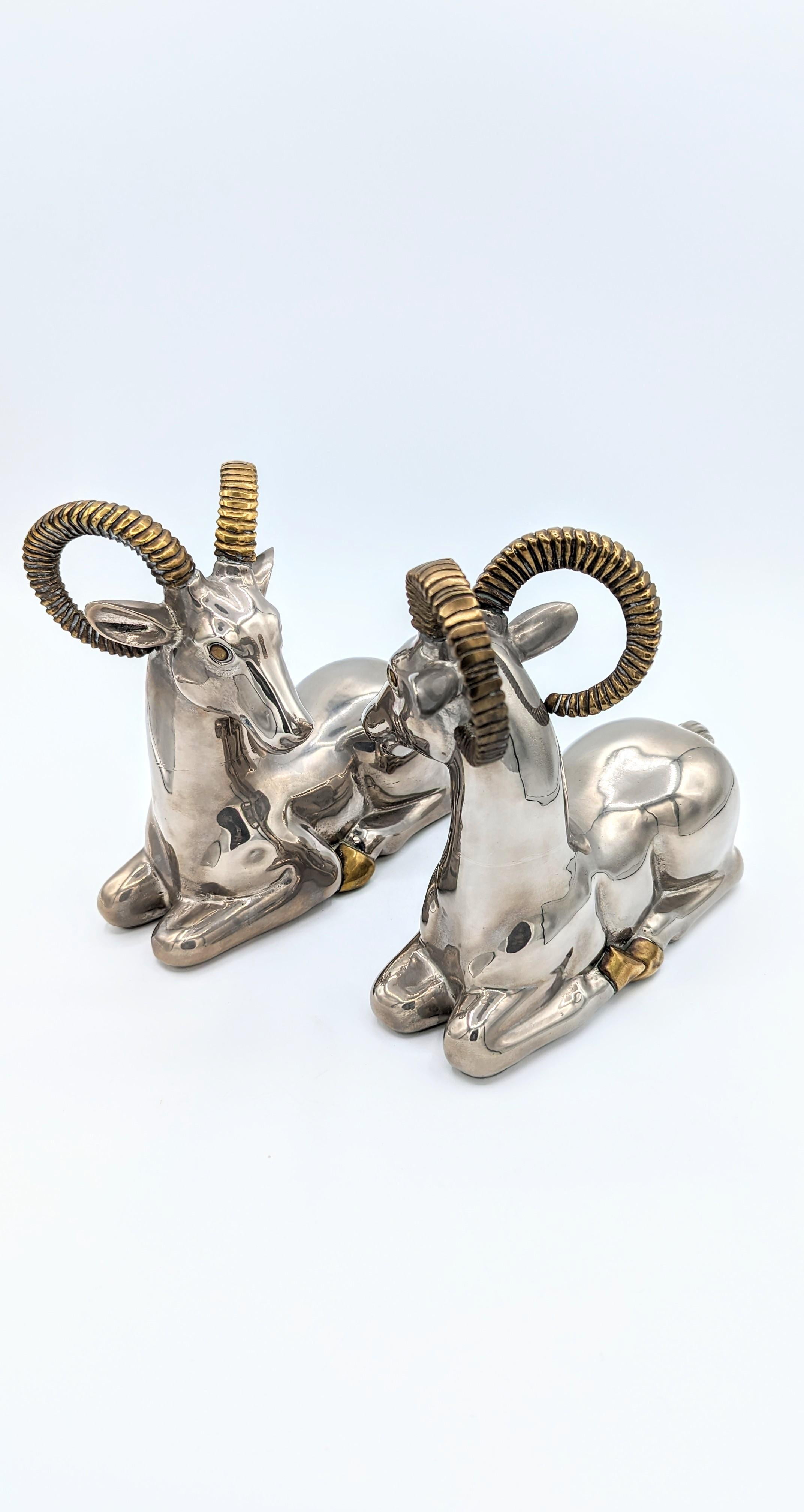 Rare pair of ram Bookends in mixed metal chrome and brass, manufactured in France in 1970s. Really very decorative objects, you can use them as a bookend but also as decorative sculptures on a piece of furniture or a table. Of the nicest effect