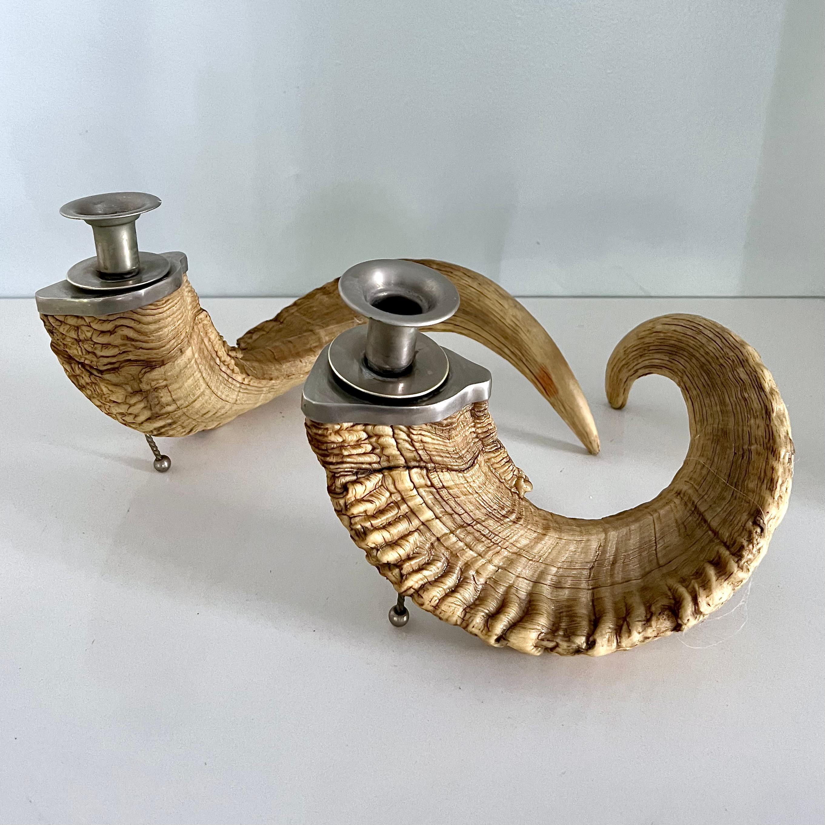 This pair of ram horn candlestick holders is in very good condition. 

 A fun and creative set. A natural compliment to sport rooms and cabins. Perhaps your 