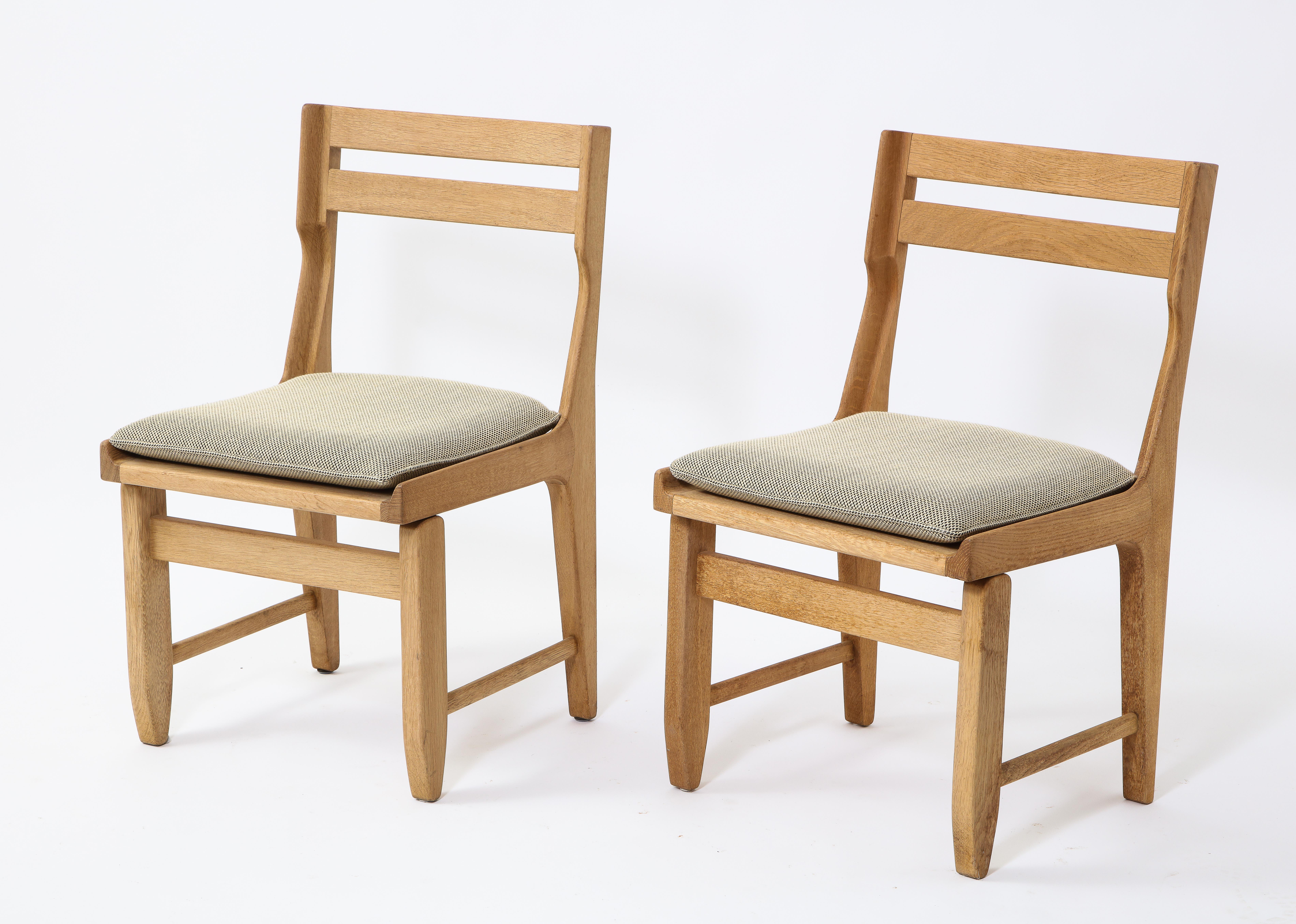 Solid oak chairs by Editions Votre Maison. Designed by Guillerme and Chambron. Beautifully crafted dovetail details.

Original upholstery and light green wool fabric cushion in good vintage condition.
