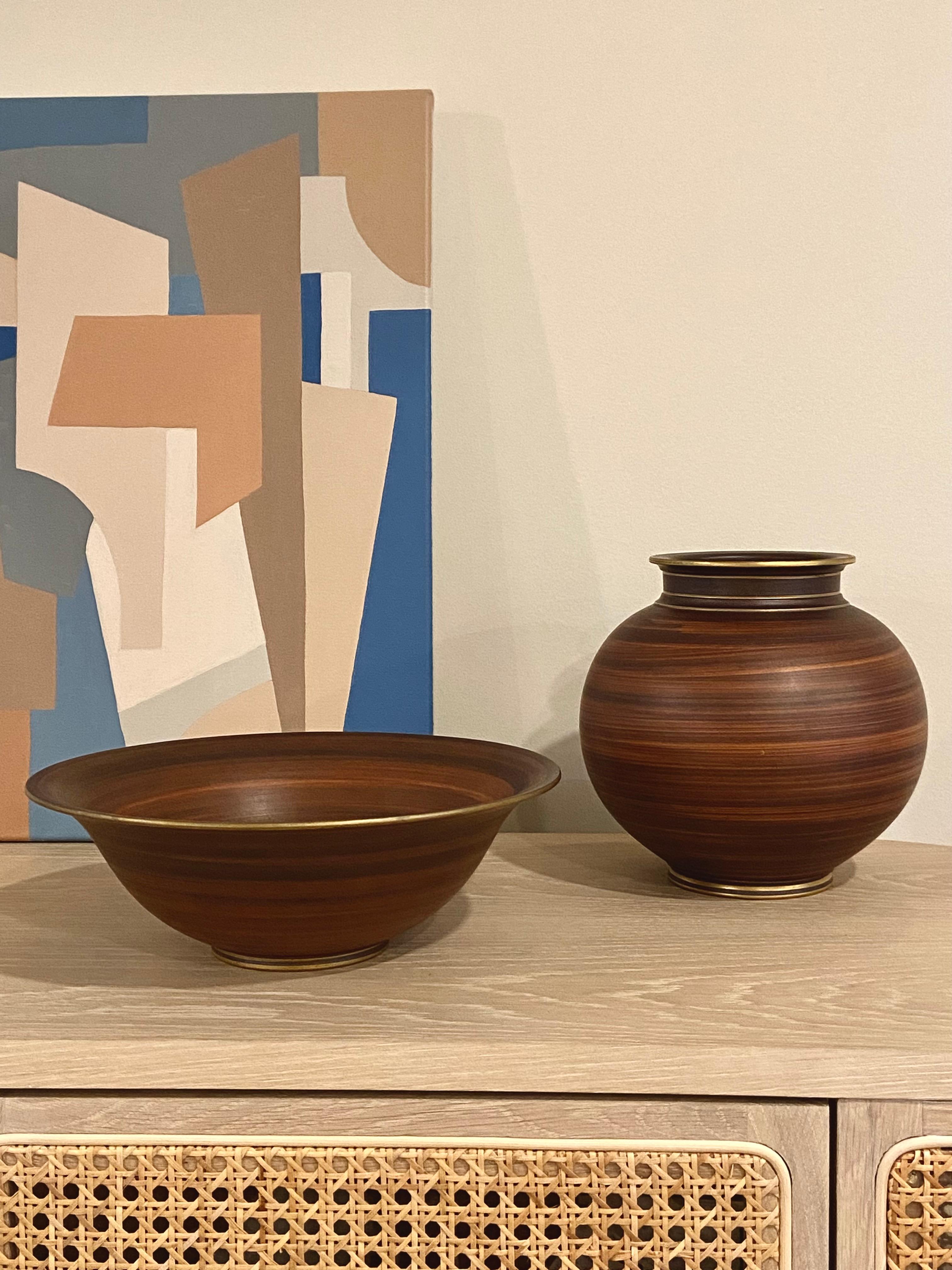 A fantastic pair of vintage Gunnar Nylund designed ceramics. This bowl and vase pair have an extraordinary hand painted faux boise wood grain pattern. They have a matte burnt sienna glaze that's been applied with a dry brush and the effect is a warm
