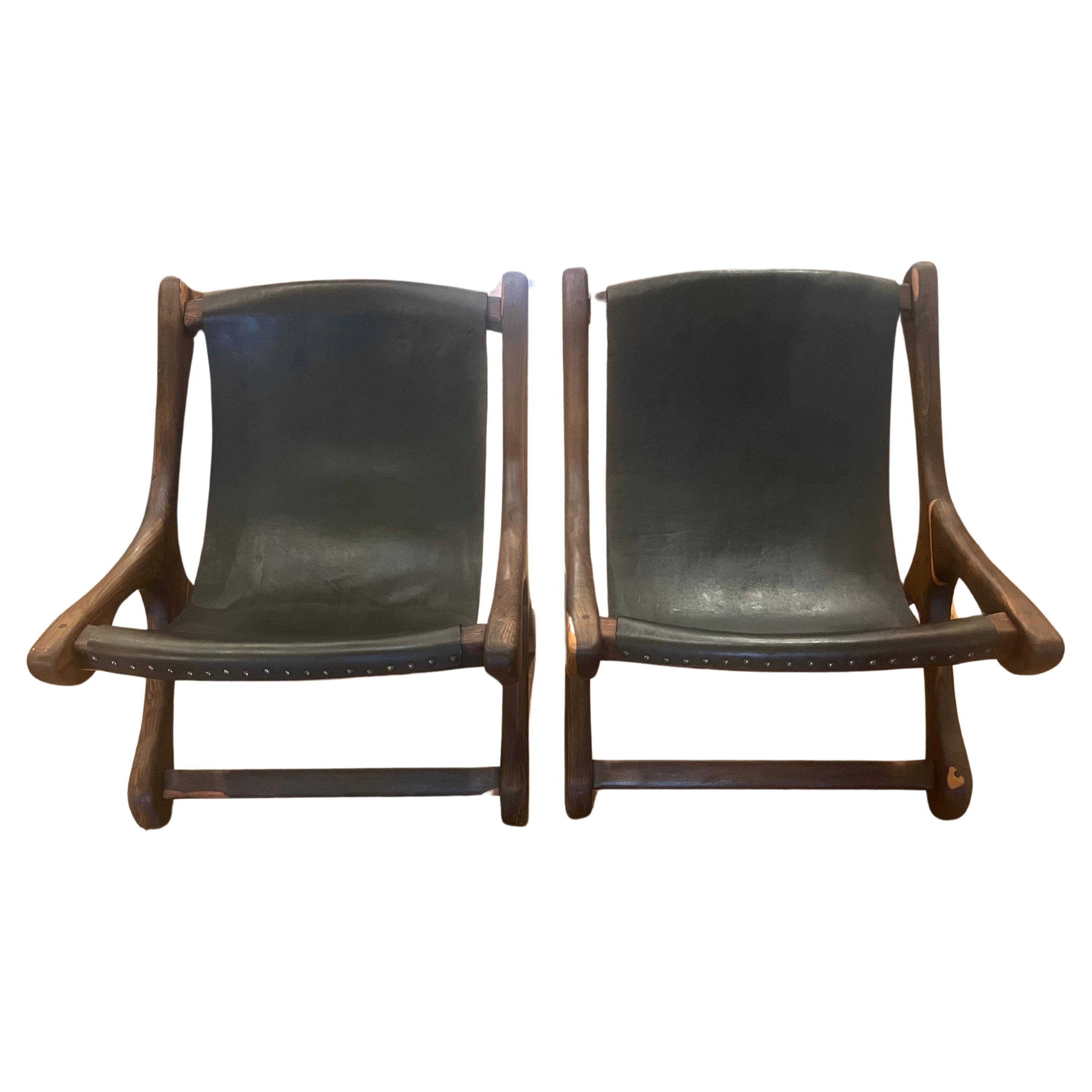 A unique and beautiful pair of solid rosewood chairs, designed by Don Shoemaker Mexican Modernism, circa 1950s freshly restored great condition nice leather and wood refinished.