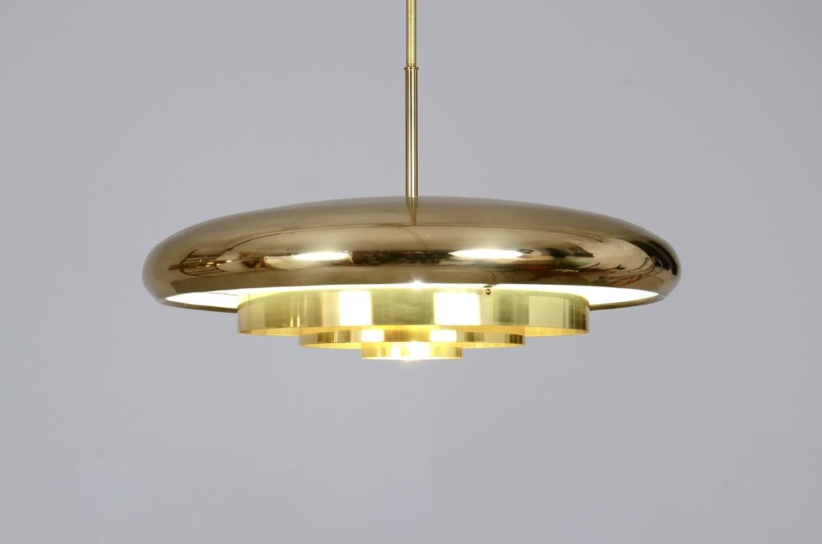 Mid-Century Modern Pair of rare 1960's ceiling lamps with a large shaped brass shade
