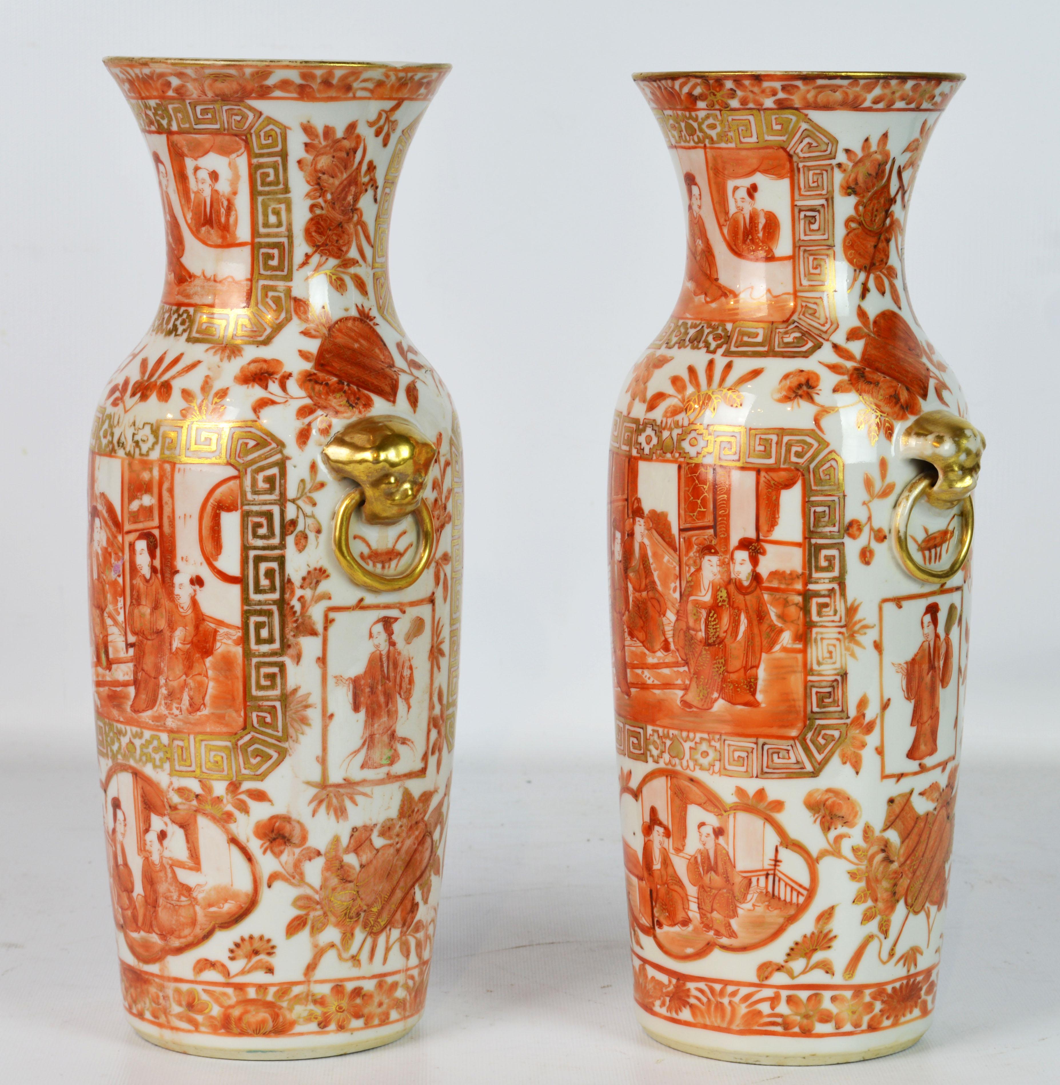 This fine pair of Chinese export vases feature white ground with rich orange and gilt enamel decoration showing domestic scenes, flowers and leafwork. They likely date to the Daoguang dynasty, circa 1840.