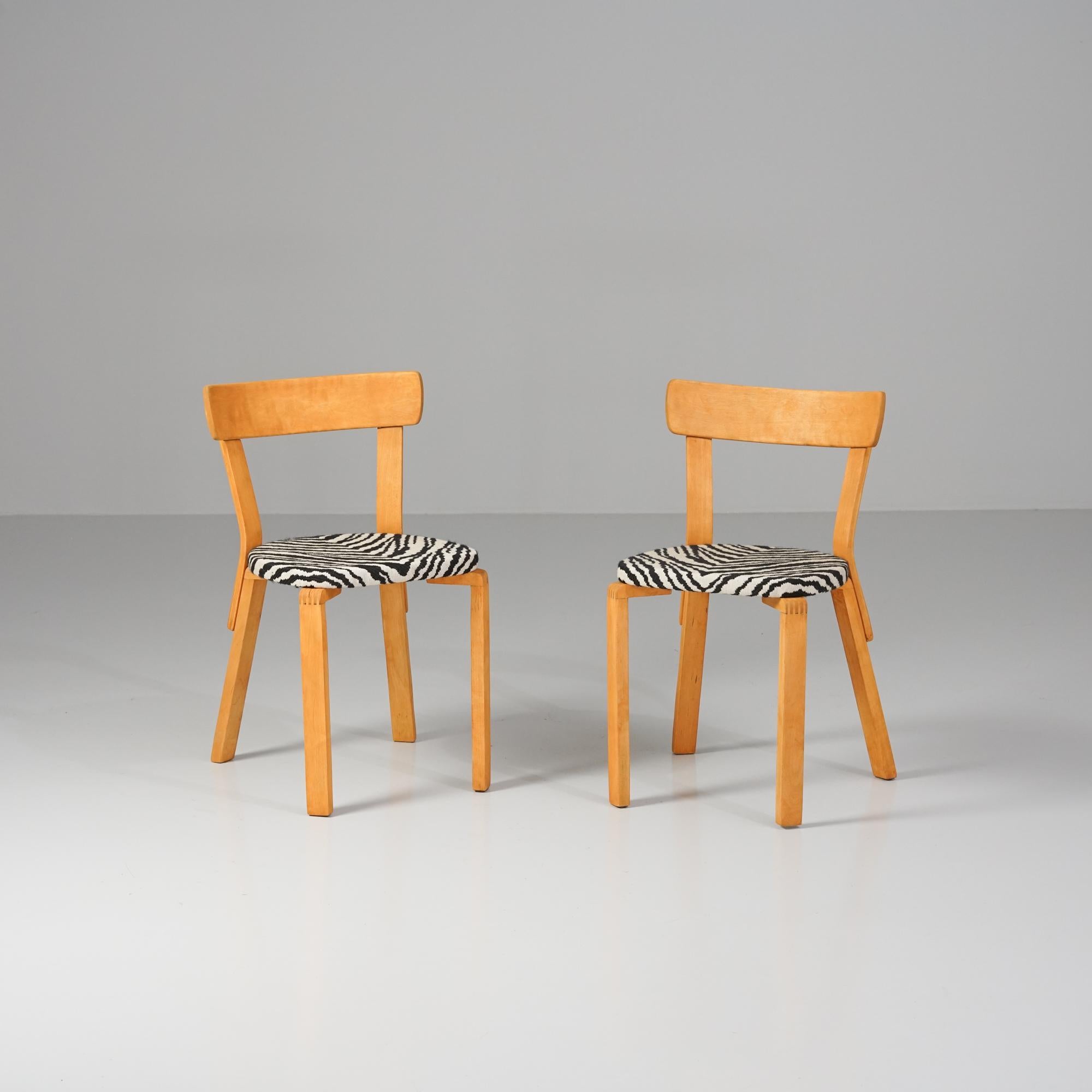 Rare model 69 wartime chairs, designed by Alvar Aalto, 1940s. Birch frame with old Artek Zebra fabric upholstery. The legs refer to the wartime when bent birch legs could not be produced. Refinishing on the birch parts. Beautiful vintage condition,