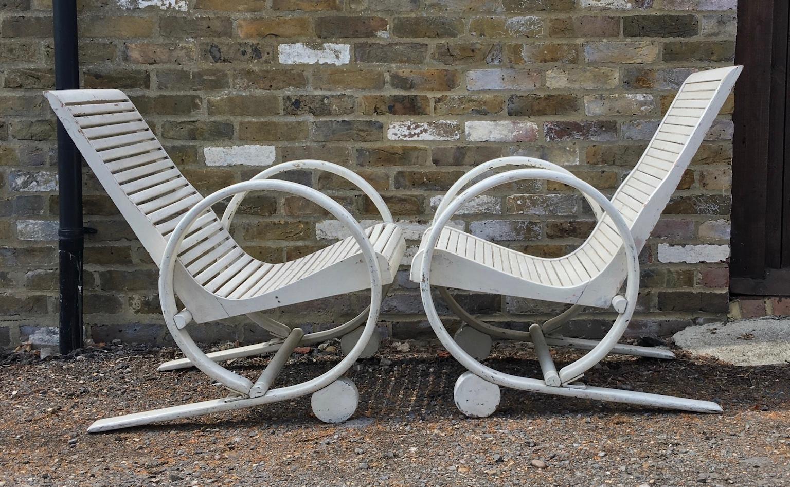 Pair of truly stunning American Art Deco garden lounge chairs, 1930
A truly unique and rare pair of chairs, with carefully crafted bentwood spring style circular armrests. Hardwood slat seat and backrest add to the charm of these impressive
