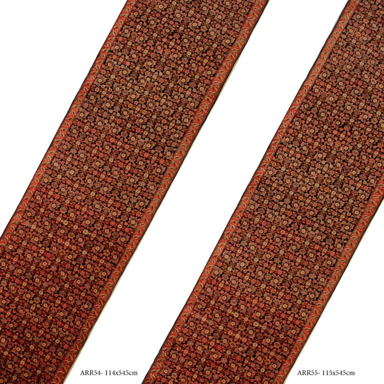 This truly unique pair of antique runner rugs have been woven by hand and feature a fantastic all-over design that has been framed with an elegant orange rust border. The central pattern is woven in colours of orange, cream and brown on a