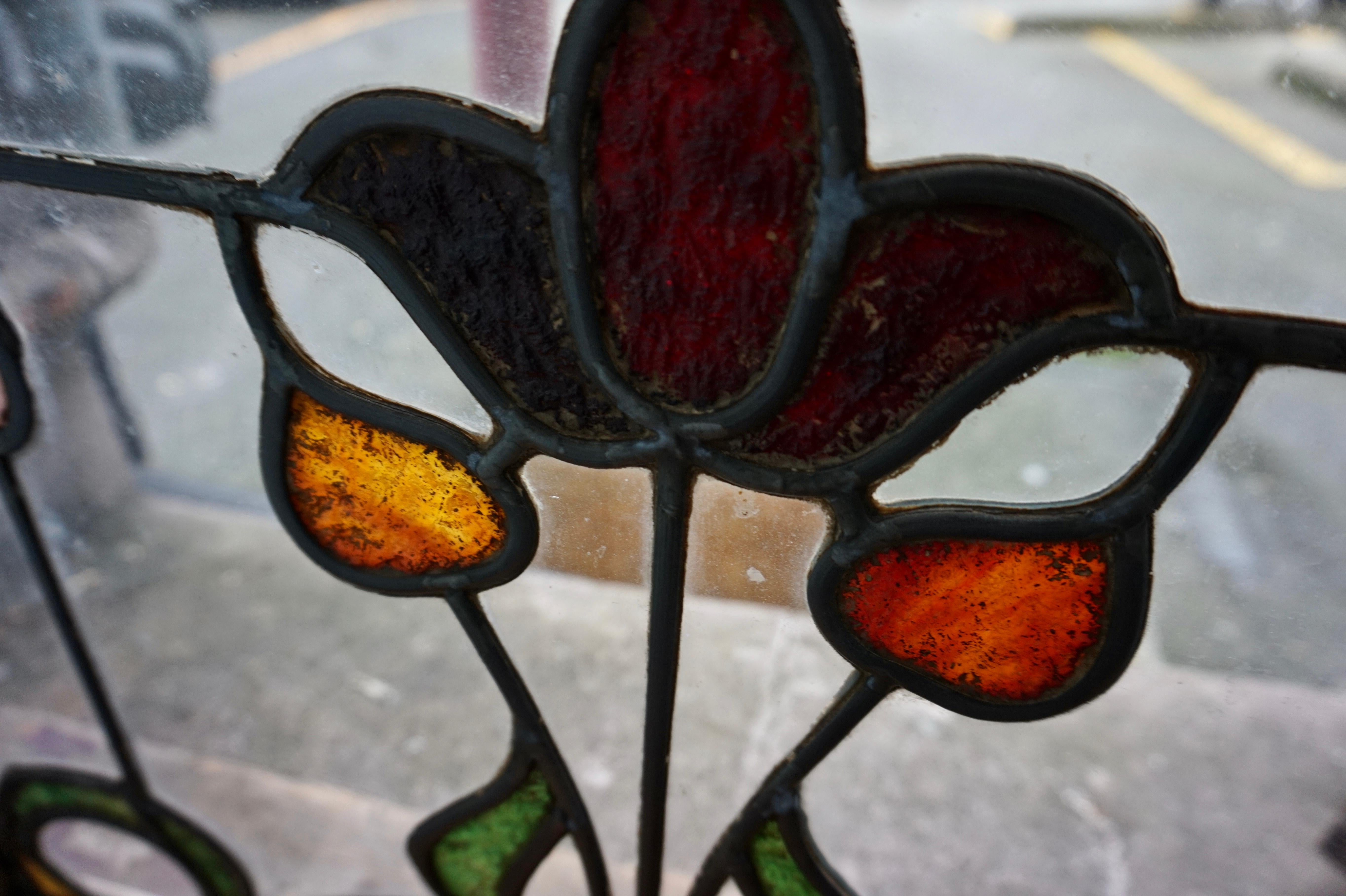 English Pair Of Rare Art Nouveau Stain Glass Windows With Scrolling Tulip & Bud Motif For Sale