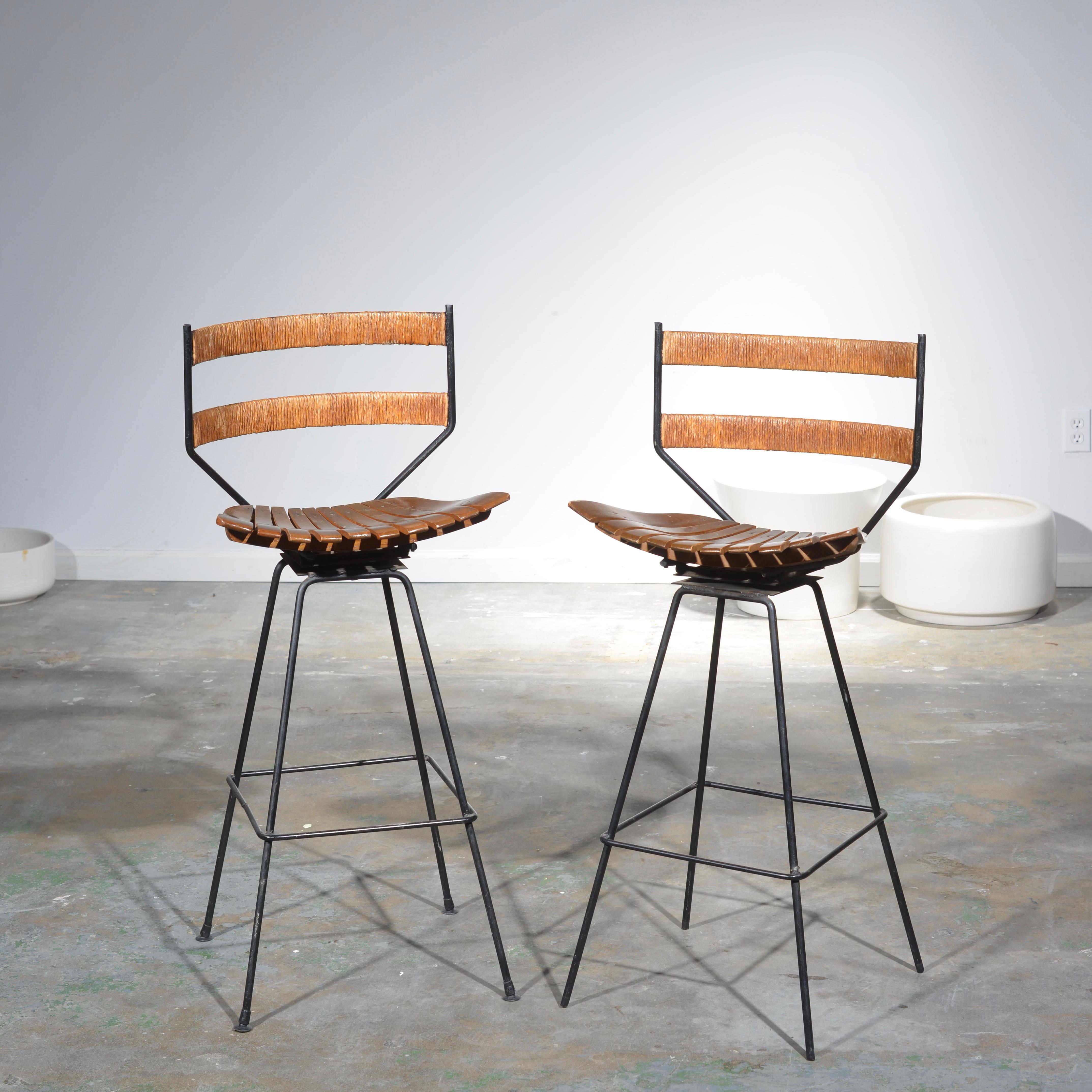 Rare pair of Arthur Umanoff for Shaver Howard wrought iron, rope and birch seat bar stools.