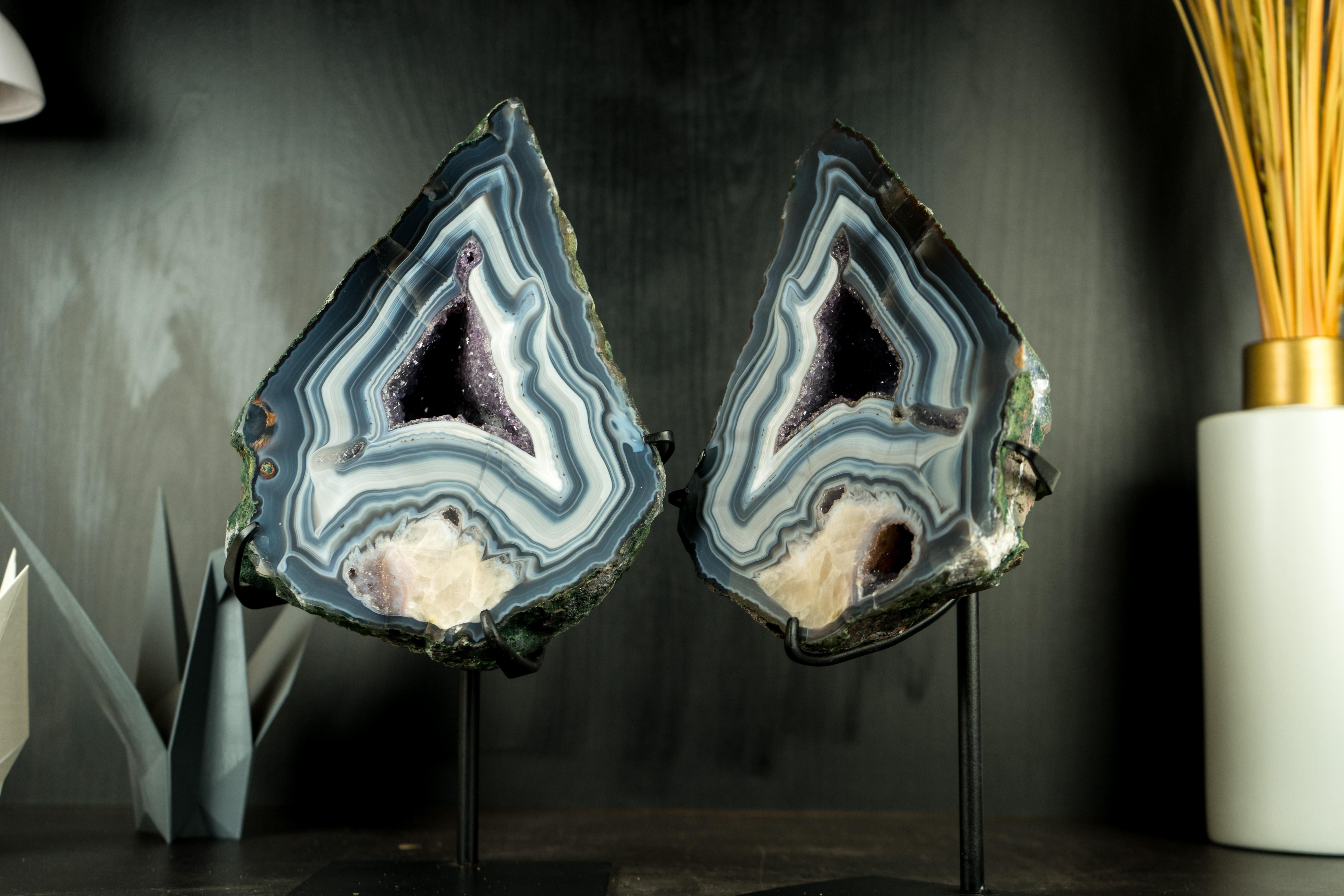 Collector's Bookmatching Pair of Blue Lace Agate Geodes: Harmoniously Matched with Rare Formations, Bold White and Blue Laces, and Calcite Flower Inclusions

▫️ Description

Crafted by nature, these rare and remarkable Blue Lace Agate Geodes are a