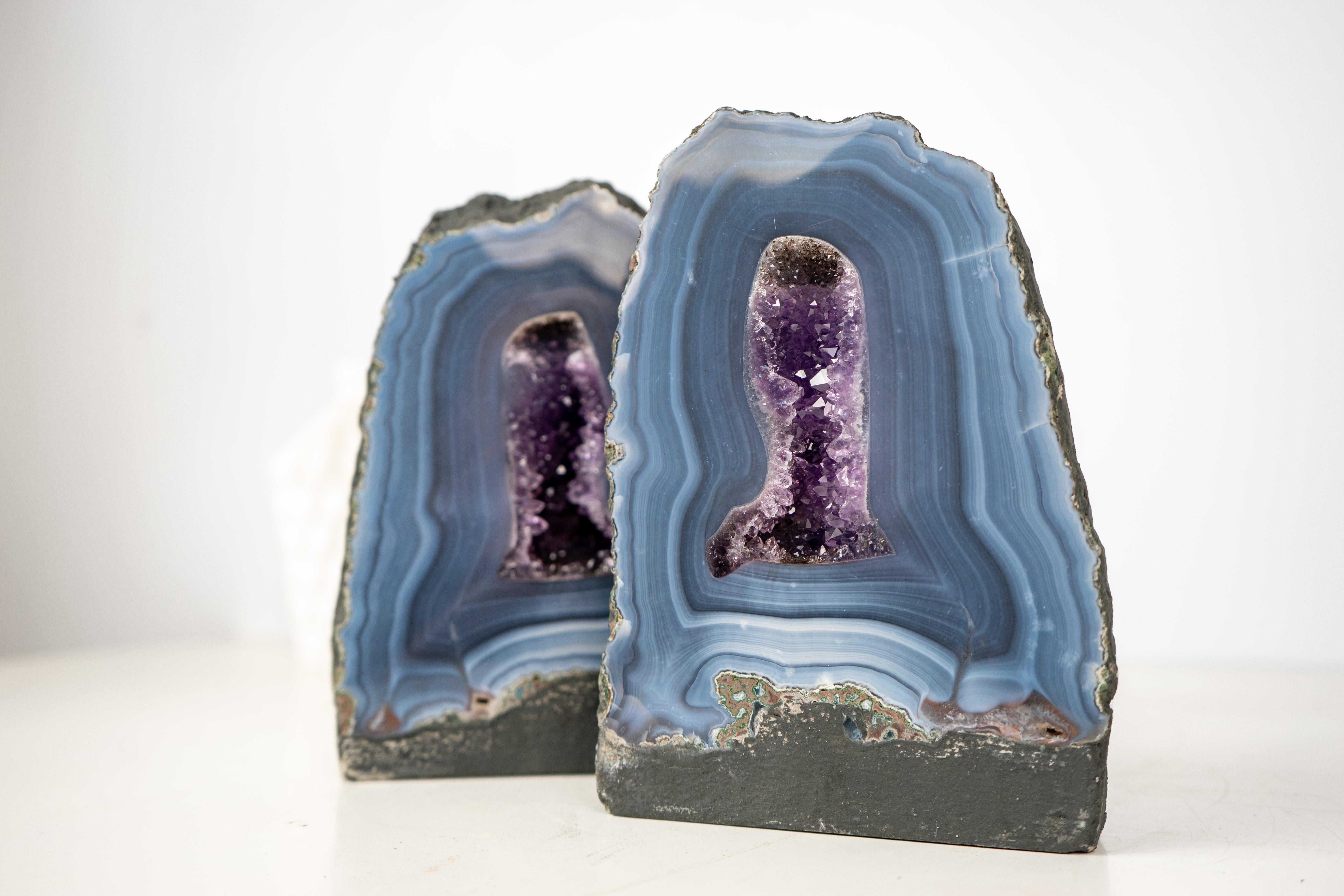 Nature's Artwork: Rare Blue Lace Agate Bookmatched Geodes with Intrinsic Striped Patterns and Quartz Interiors

Description

With rare characteristics such as striped blue-toned laces, stunning aesthetics, and amethyst crystal centers, this