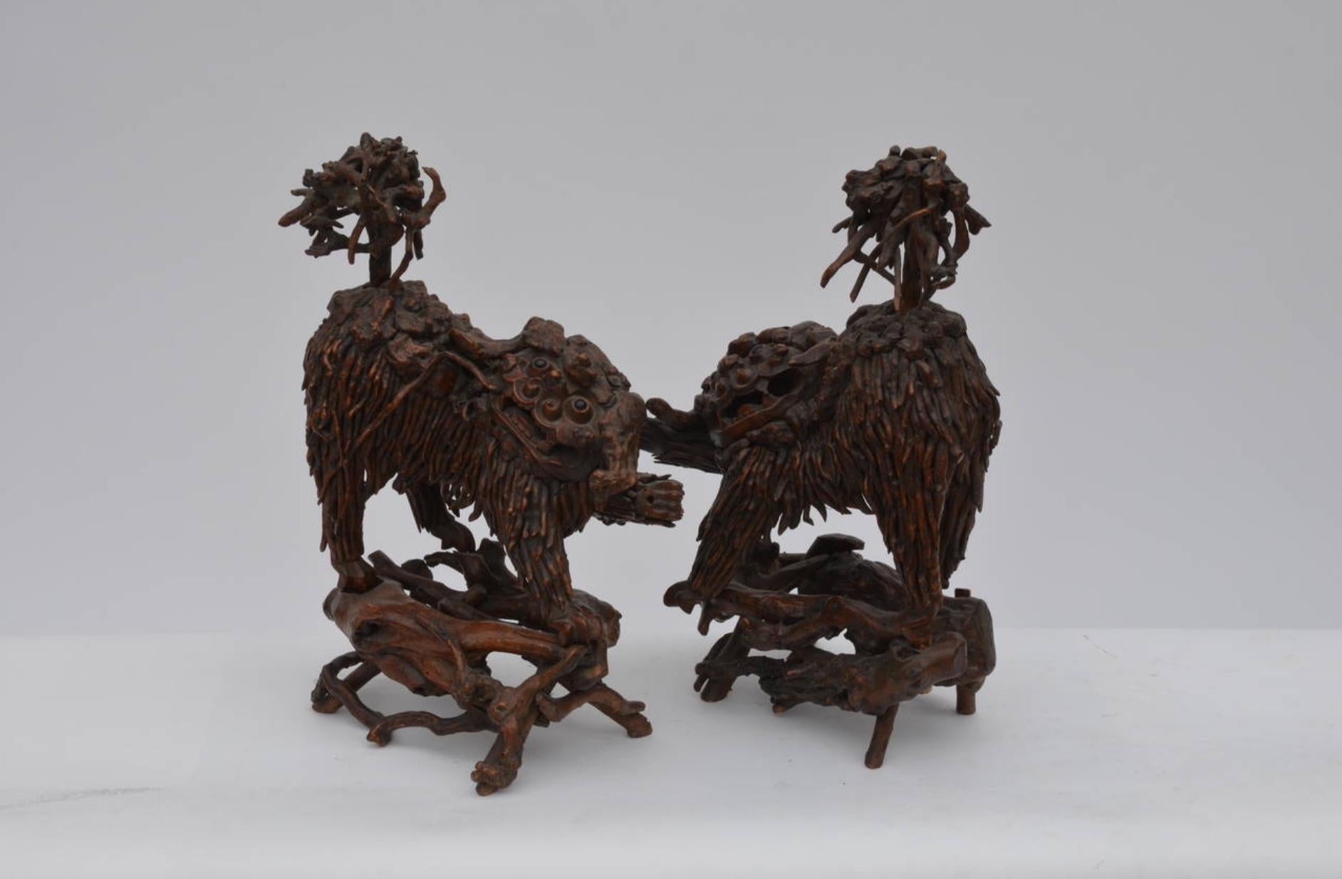 Pair of rare Chinese carved wood foo dogs.