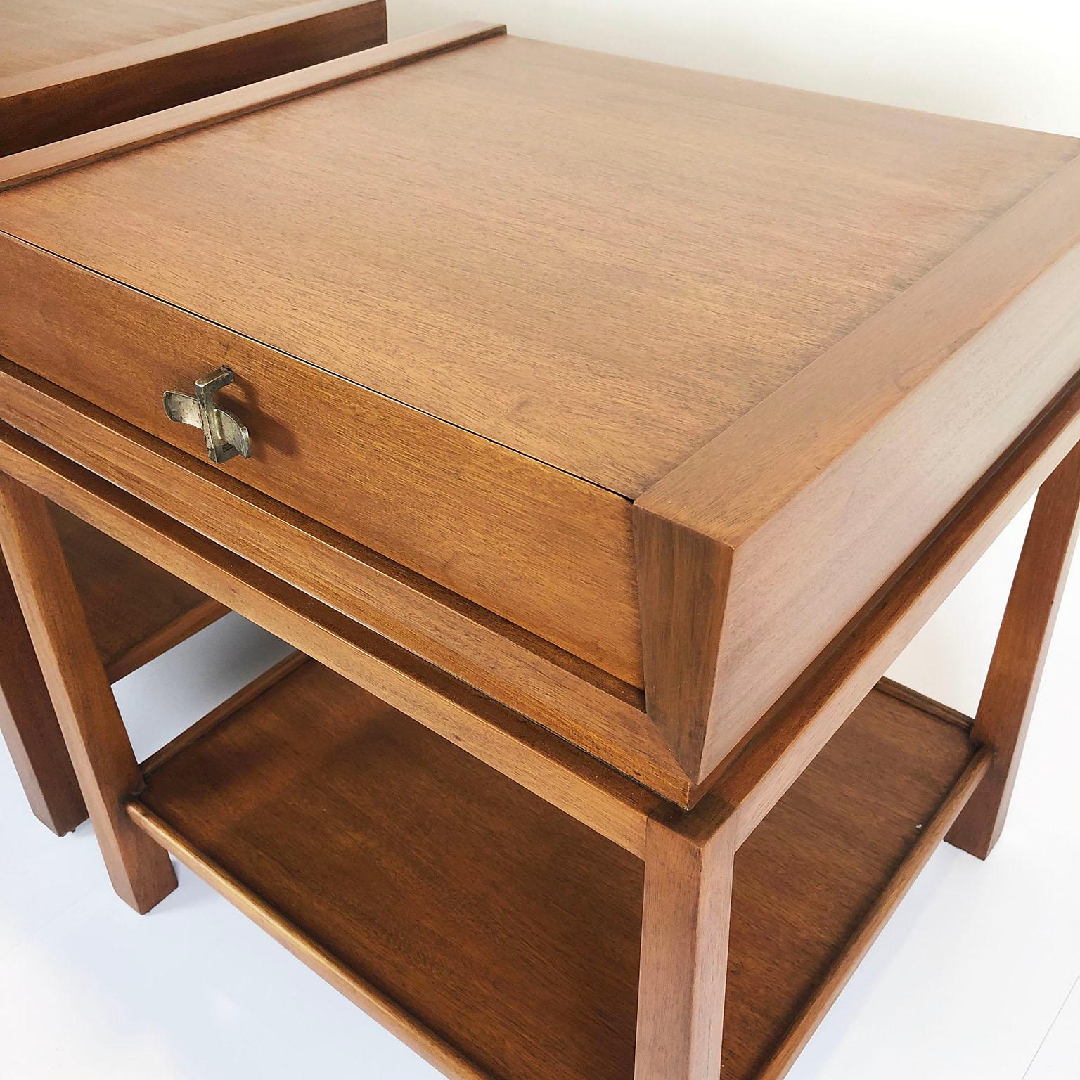 Rare Edmond Spence nightstands in mahogany with a single drawer with cast bronze pull, circa 1950. Great profile with tapering legs and floating drawer cassette. Model 53.
 