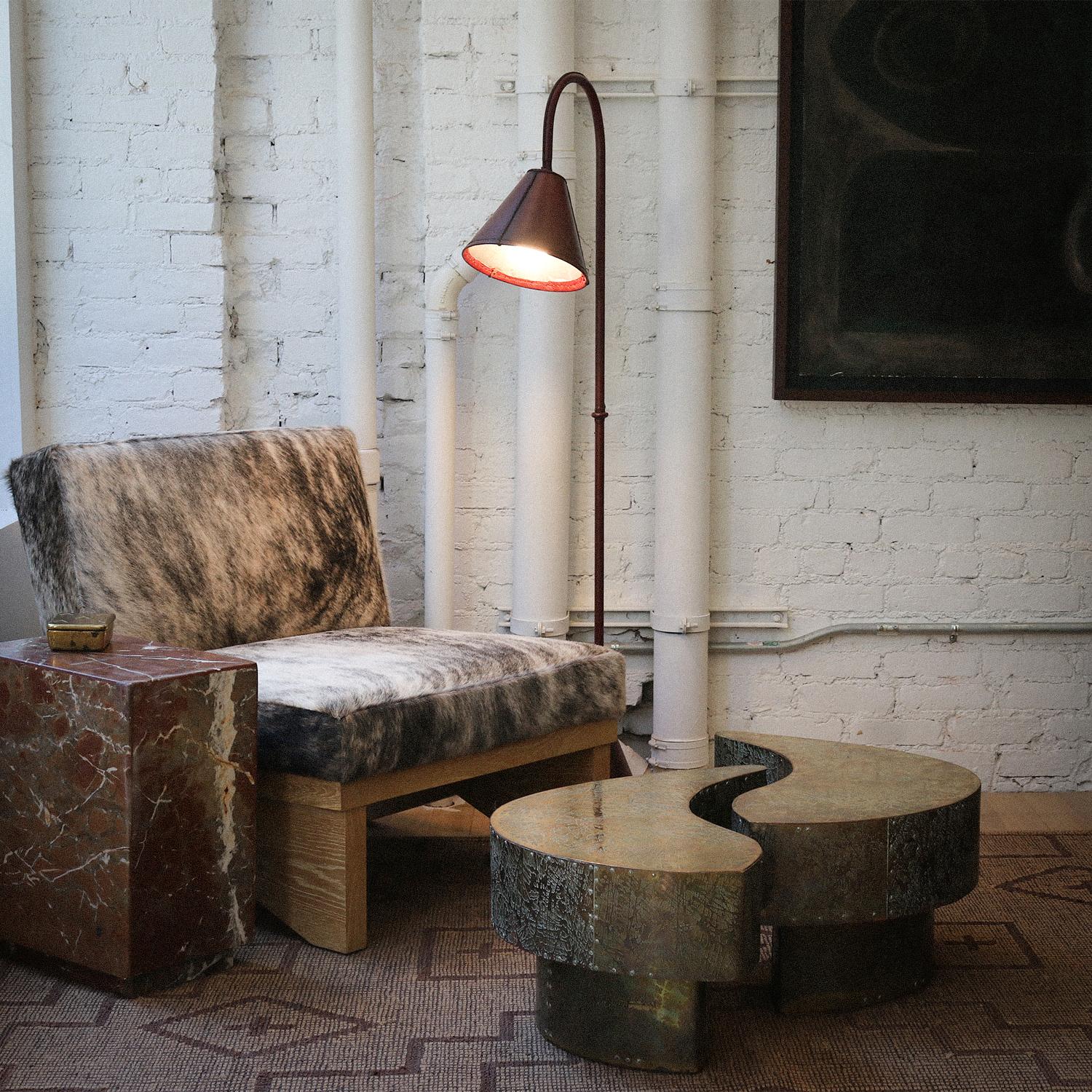 These extraordinary etched brass tables embody the raw beauty and sculptural presence that define mid-century design at its most avant-garde. Their interlocking, biomorphic form is a testament to the era’s fascination with organic modernism, while