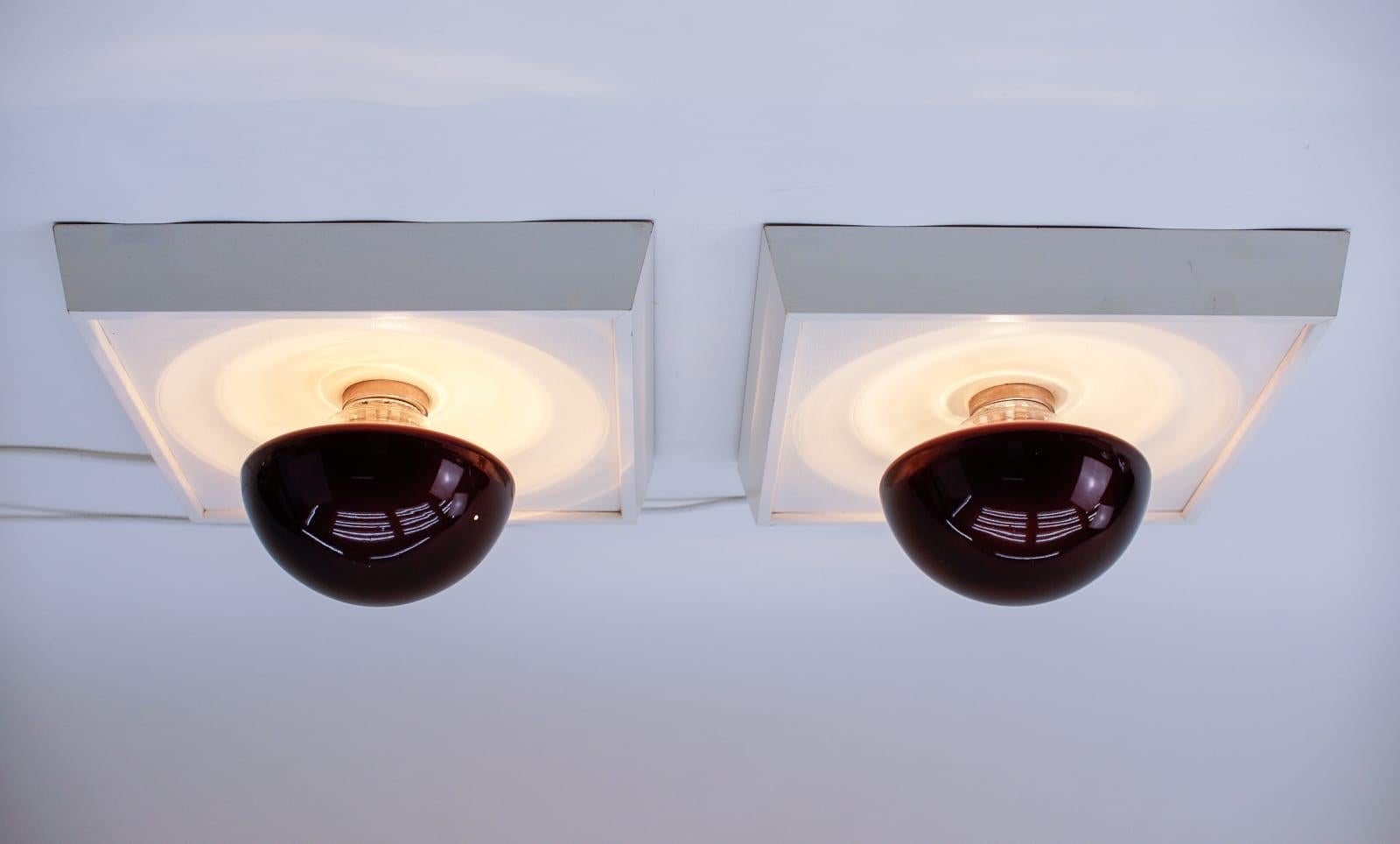 Pair of rare flush mounts or wall lamps by Temde, Switzerland 1960s

Made in wood and glass.

Fully functional.

Each with E14 socket. Works with 220V and 110V.

Wiring is suitable for all countries.