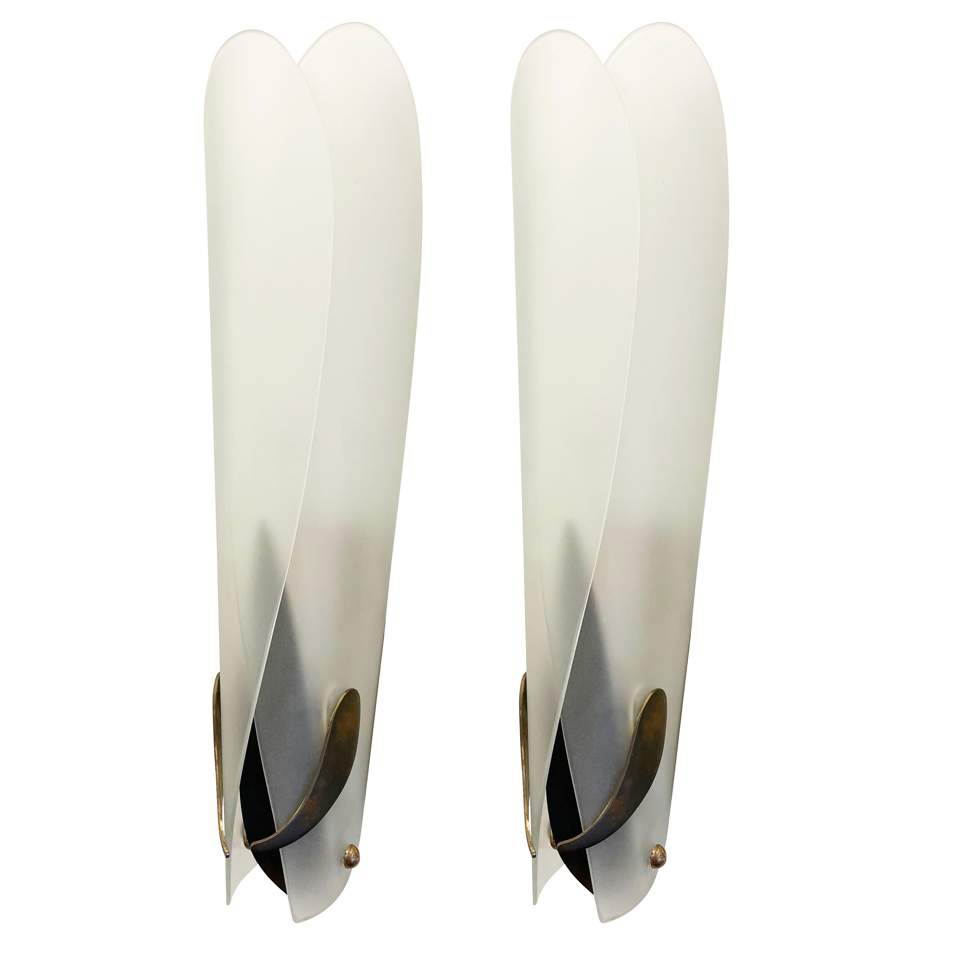 Pair of rare Fontana Arte wall lights designed by Max Ingrand in the late 1950s. Each features two overlapping frosted glass shades on a brass frame. Each holds one Edison socket.

Condition: Excellent vintage condition, minor wear consistent with