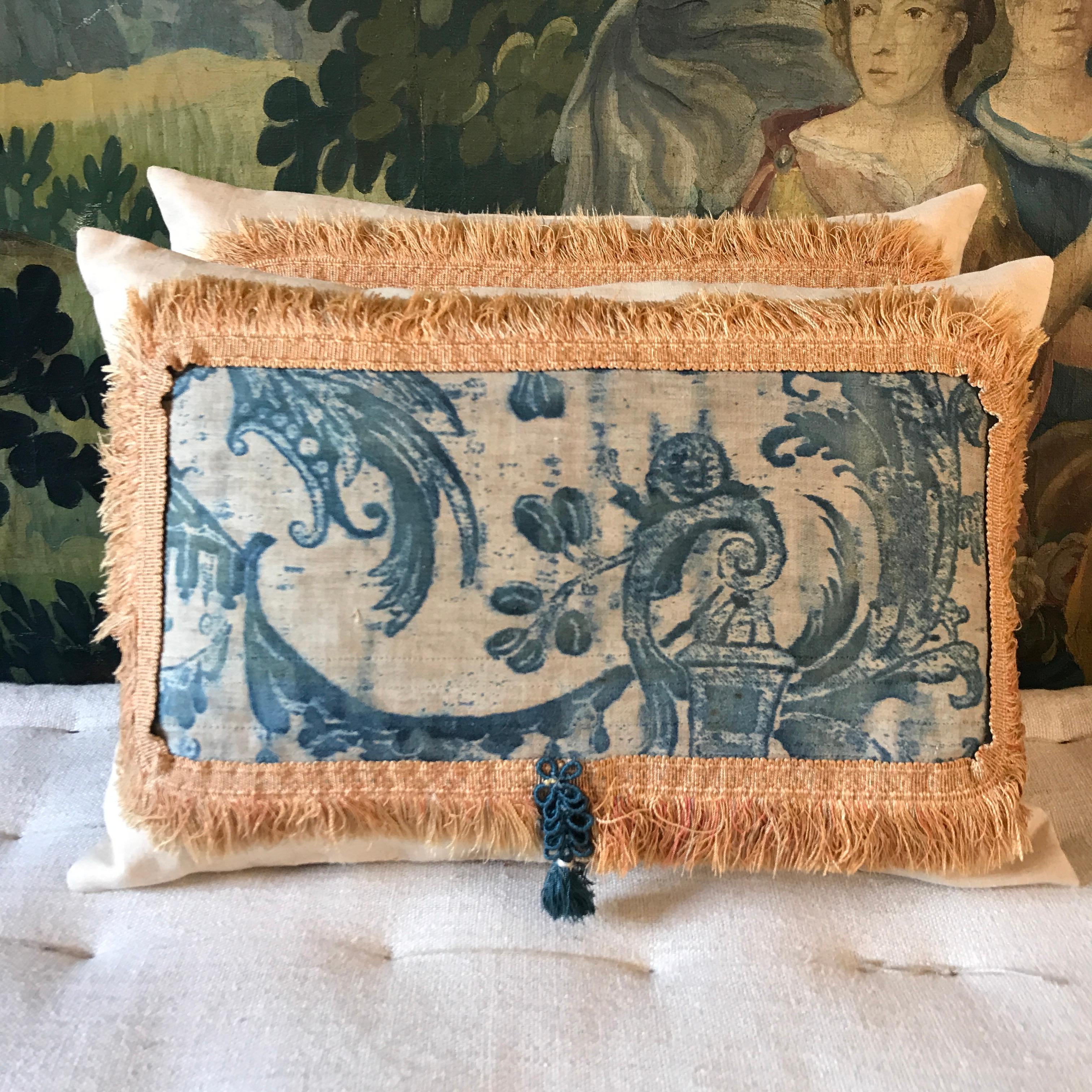 A pretty cushion made using an early hand blocked Fortuny textile dated to circa 1910  - a very rare design now discontinued featuring fauns and snails in beautiful indigo blue - this panel has a snail on - placed onto antique Italian silk then