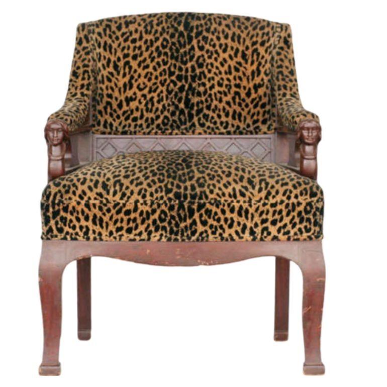 Immerse yourself in the timeless beauty of our vintage oak Empire-style chairs. Each chair is adorned with eye-catching Leopard print upholstery and features intricately hand-carved arms depicting a graceful woman. This fusion of classic design and
