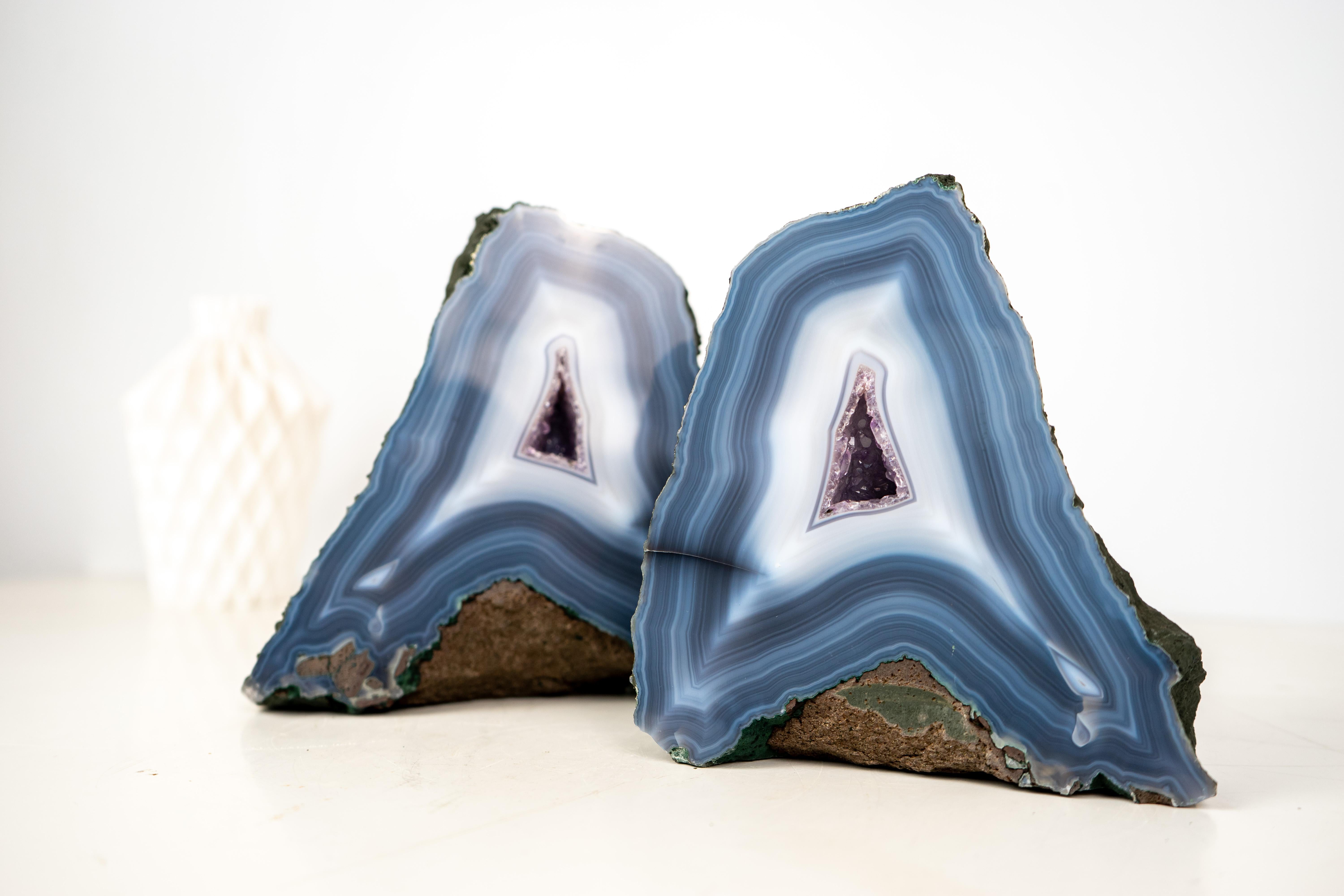 All-Natural Agate Artwork: Rare Blue and White Lace Agate Bookmatched Geodes with Amethyst Cores, Intact

▫️ Description

A rare specimen with exceptional aesthetics, this pair of bookmatched agate geodes brings together unique, seldom-seen