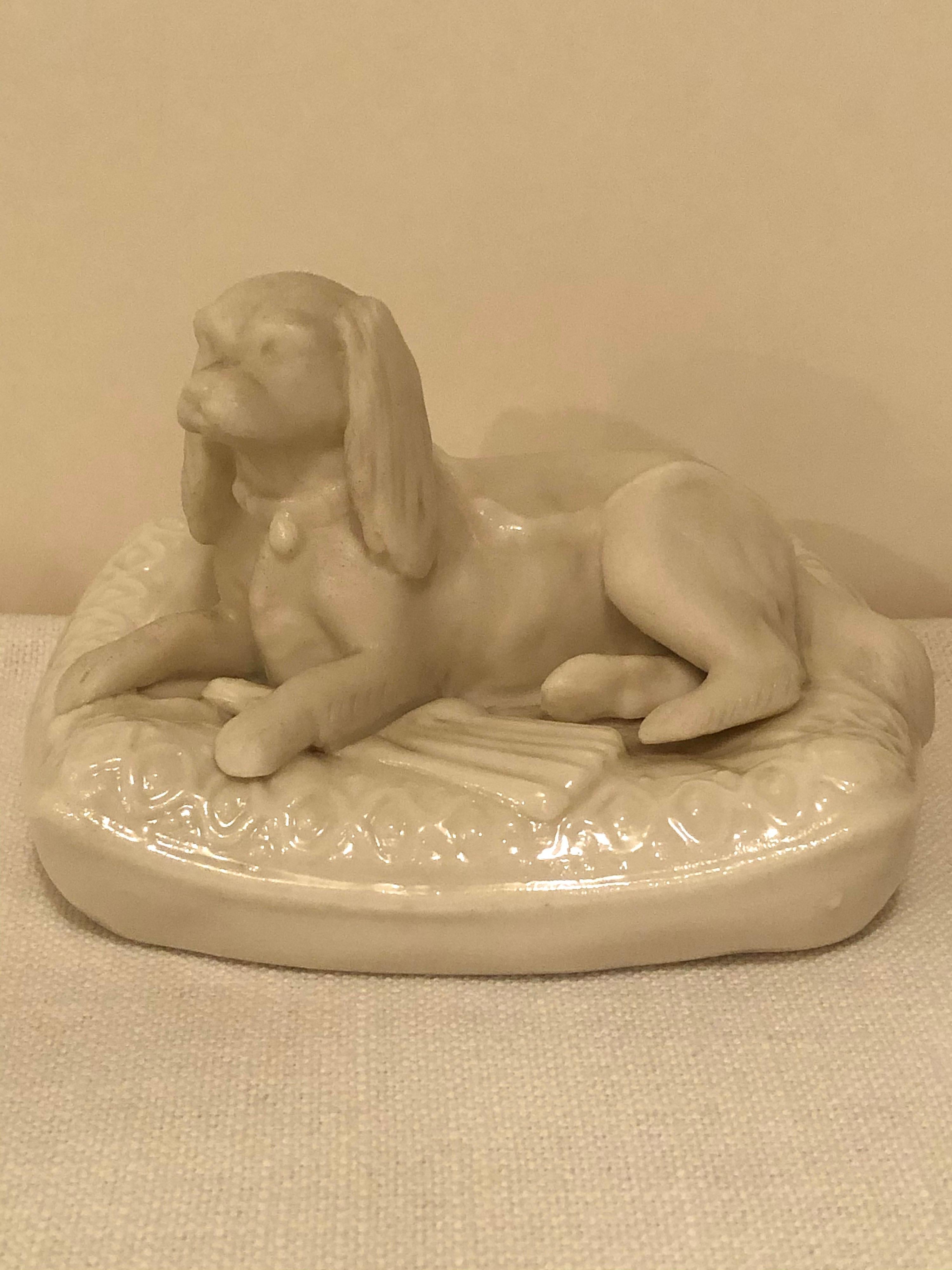This is an adorable pair of rare Irish Belleek figures of doggies on their pillow beds. I have never seen a pair like these in 30 years. These would be a fabulous addition to any Belleek collection. They would also be an enchanting decoration for