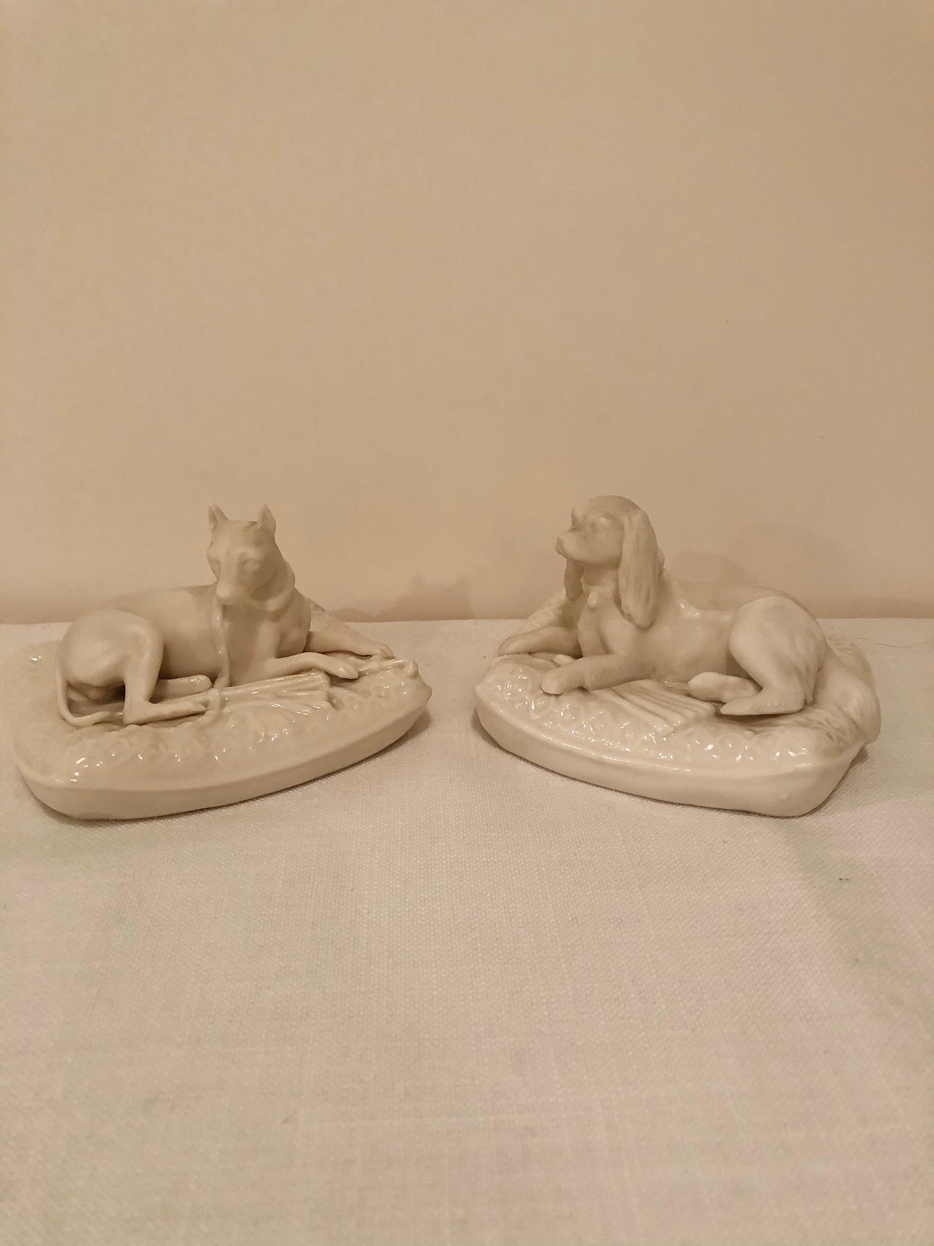 Molded Pair of Rare Irish Belleek Figures of Dogs on Their Pillow Beds