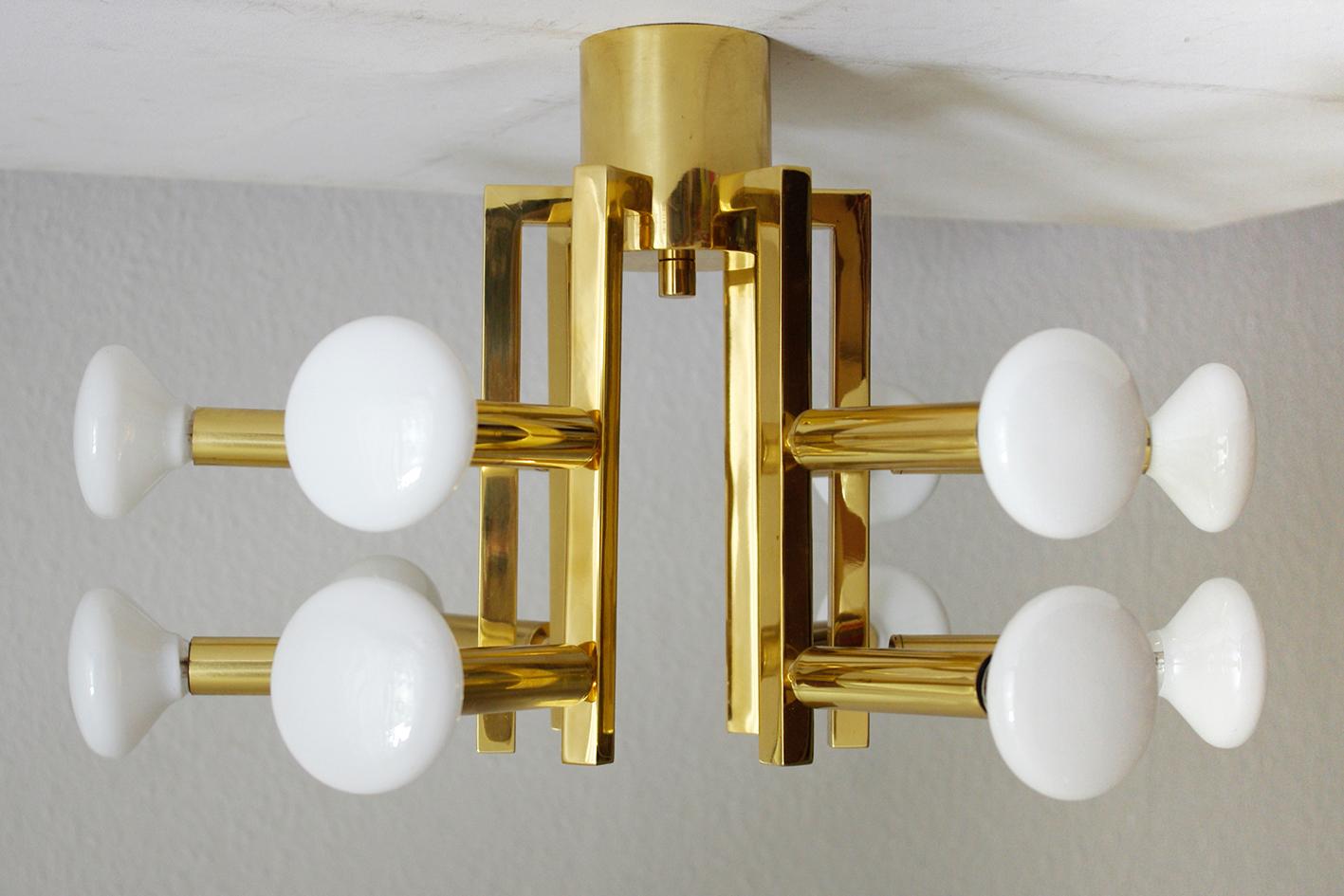 TWO beautiful twelve-arm minimalist flush mounts/chandeliers or pendants (on request), Italy, 1960s.

Lamp sockets: 12
Measures: Diameter 15.7 inches (without bulbs).
Height of the body 11.5 inches.

Shipping without bulbs.
 