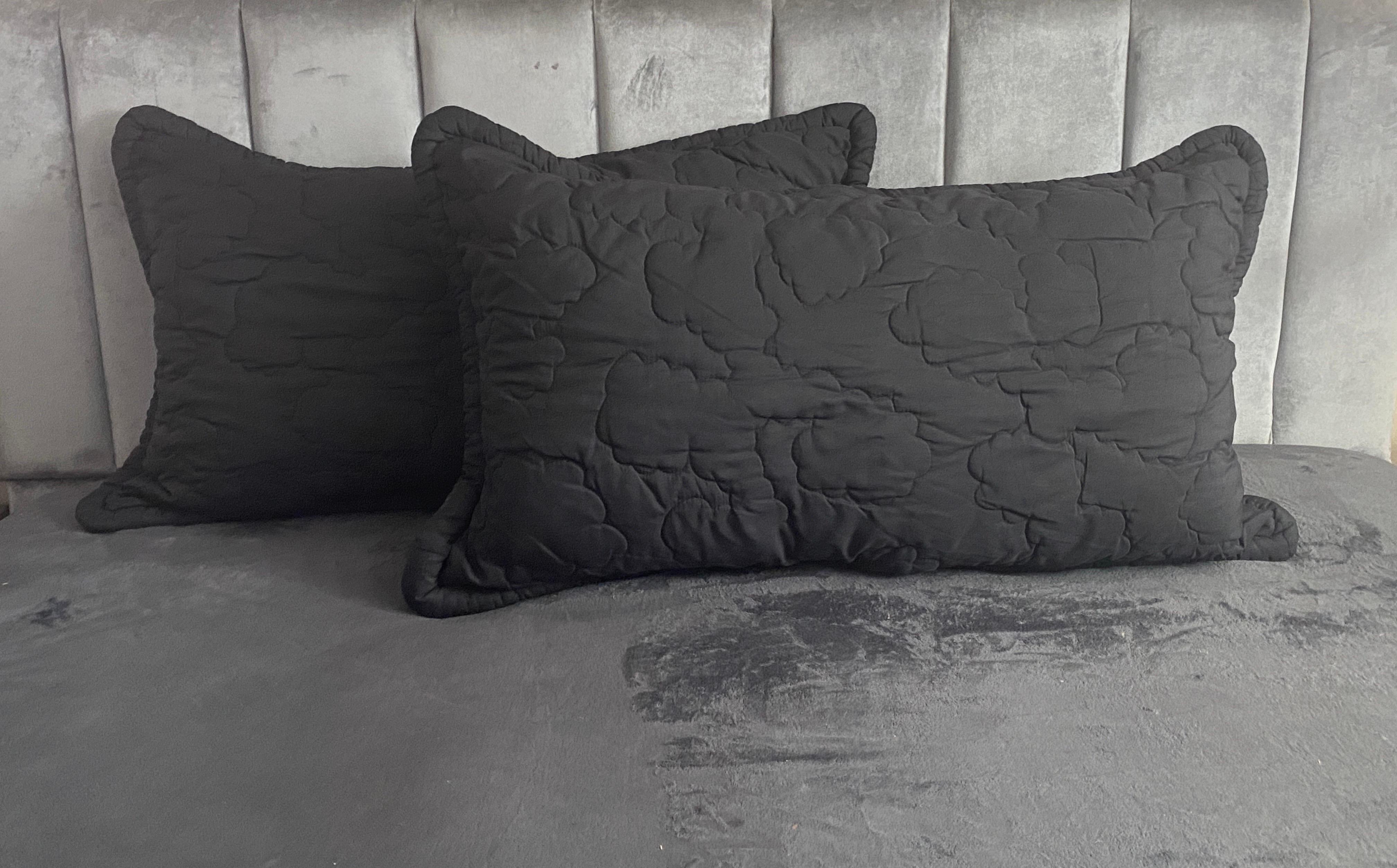 This rare pair of quilted black, king-size pillow shams came from Bloomingdale’s New York in the 1980s as part of the all, upholsterd, mint, green leopard bed designed entirely by legendary interior designer Mr. Jay Spectre. This was part of the