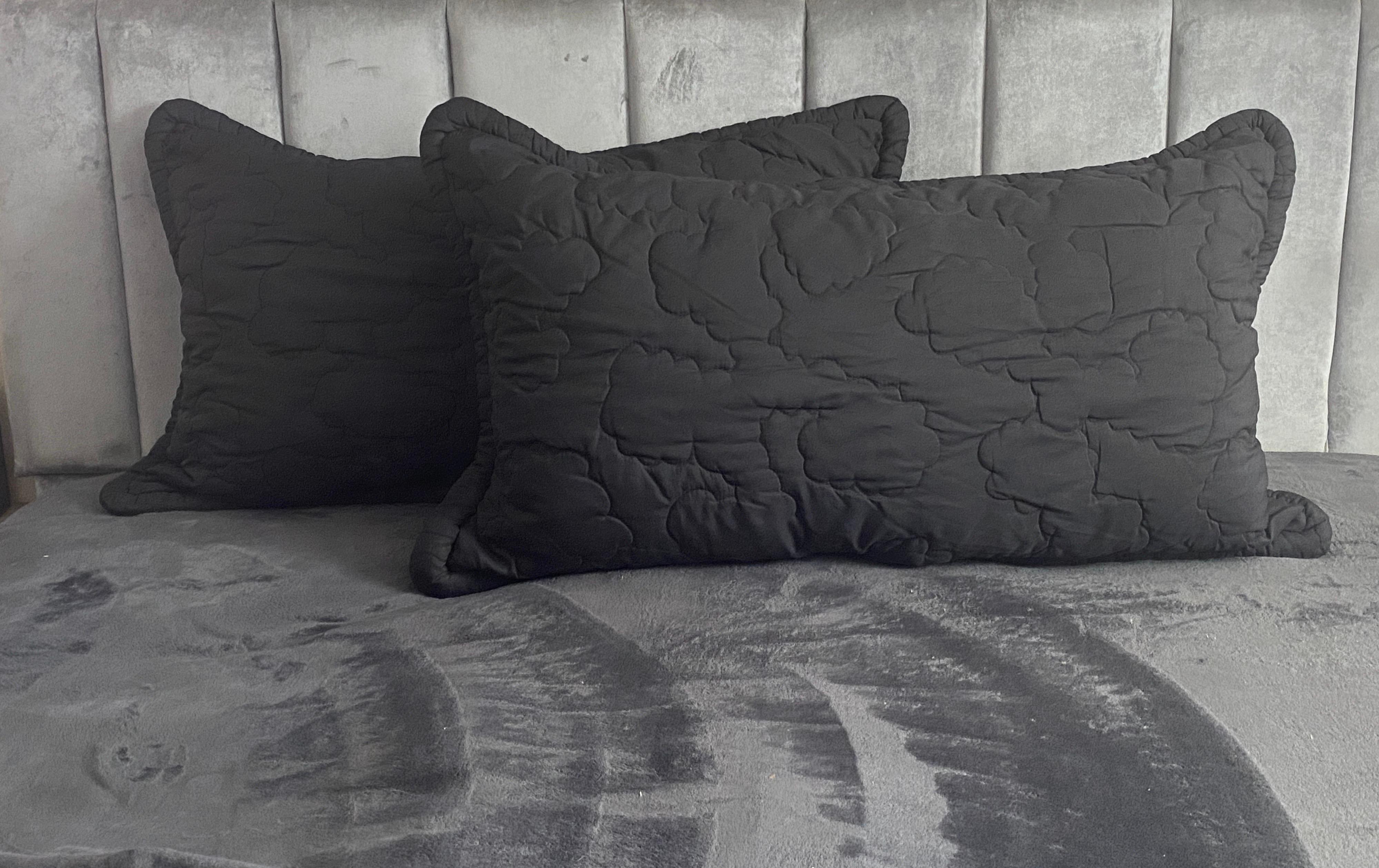 black quilted pillow shams