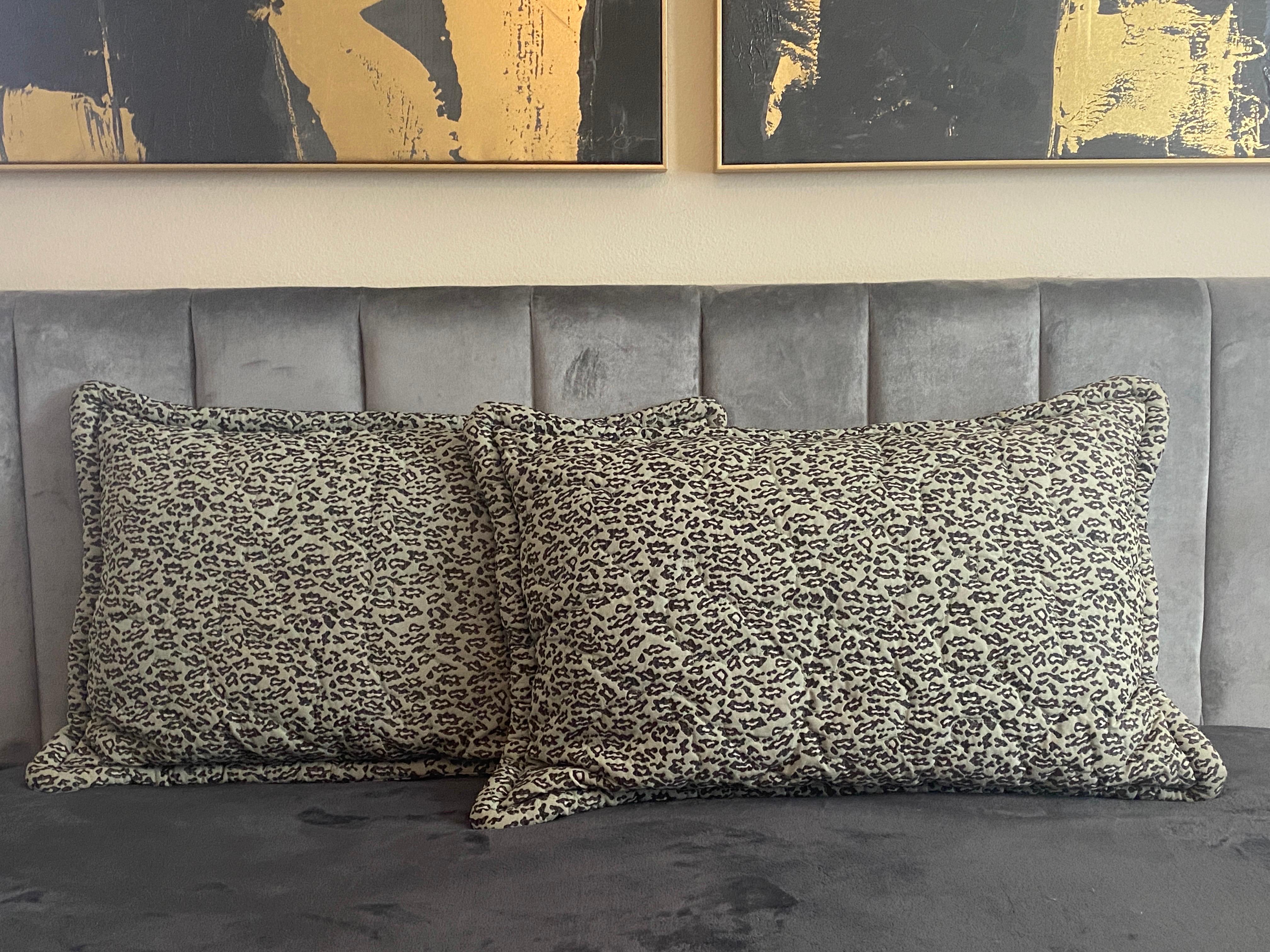 This rare pair of quilted mint color with black and white leopard pattern jacquard pillow shams came from Bloomingdale’s New York in the 1980s as part of the all upholsterd, mint green, leopard bed set designed entirely by the legendary interior