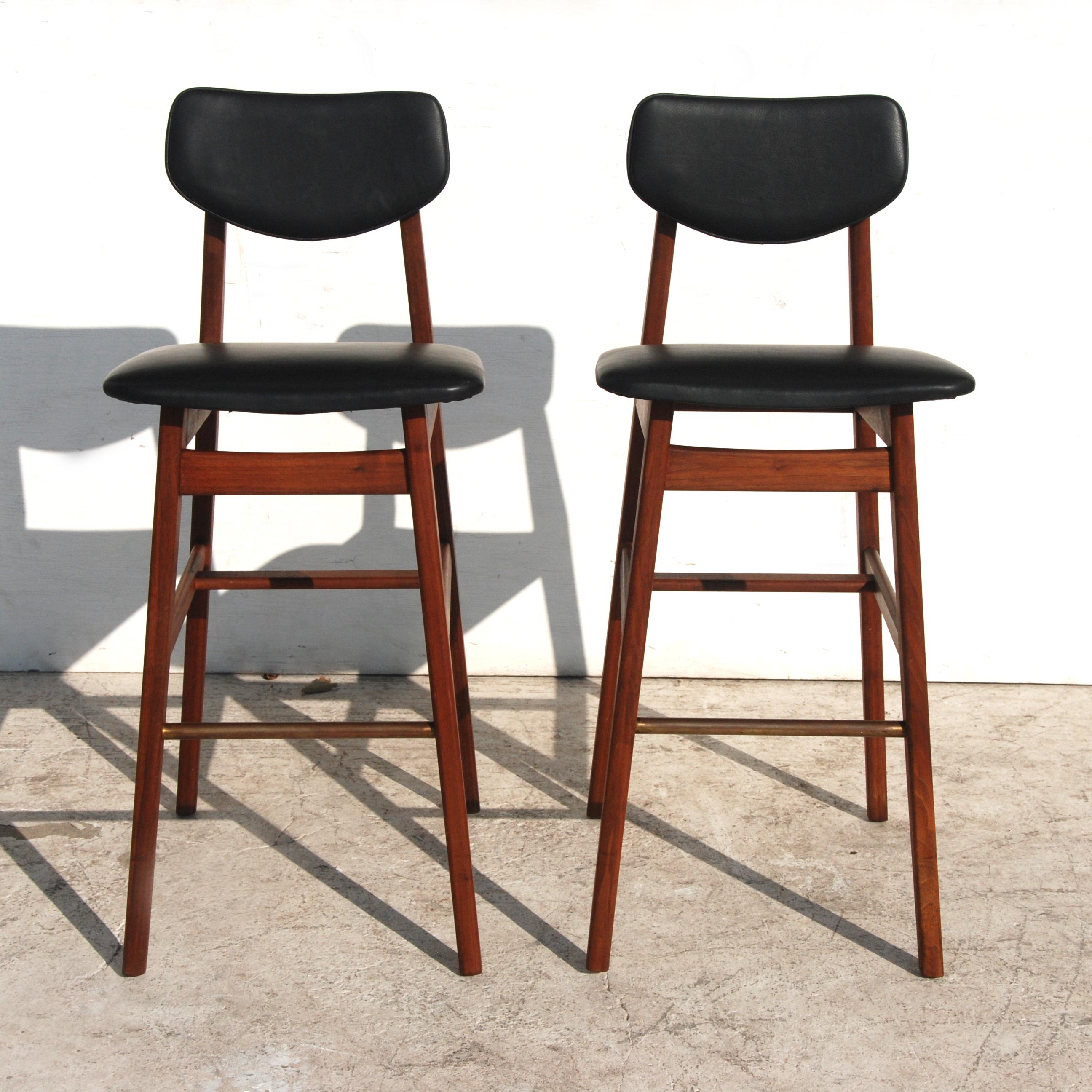 Pair of rare, iconic Jens Risom stools.
Teak with newly upholstered leather seats and backs
Brass foot rests.
27
