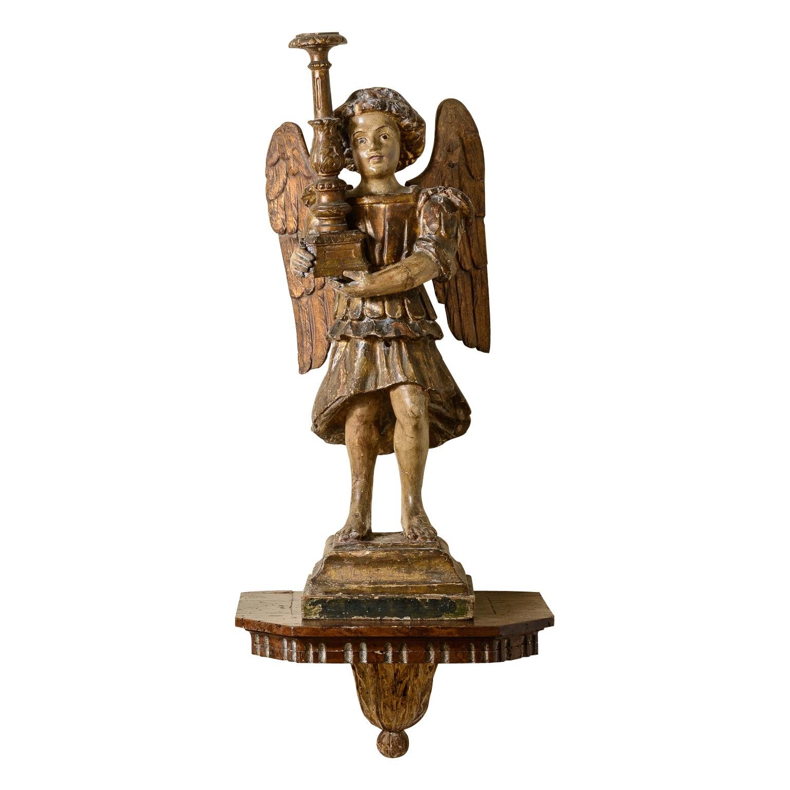 Pair of Rare, 18Th Century hand carved and gilt Angel Candlesticks on carved wood Wall Sconces
This pair is quite exceptional,  they are left and right, having large wings and holding the candlesticks with their two hands,
They stand of carved wood