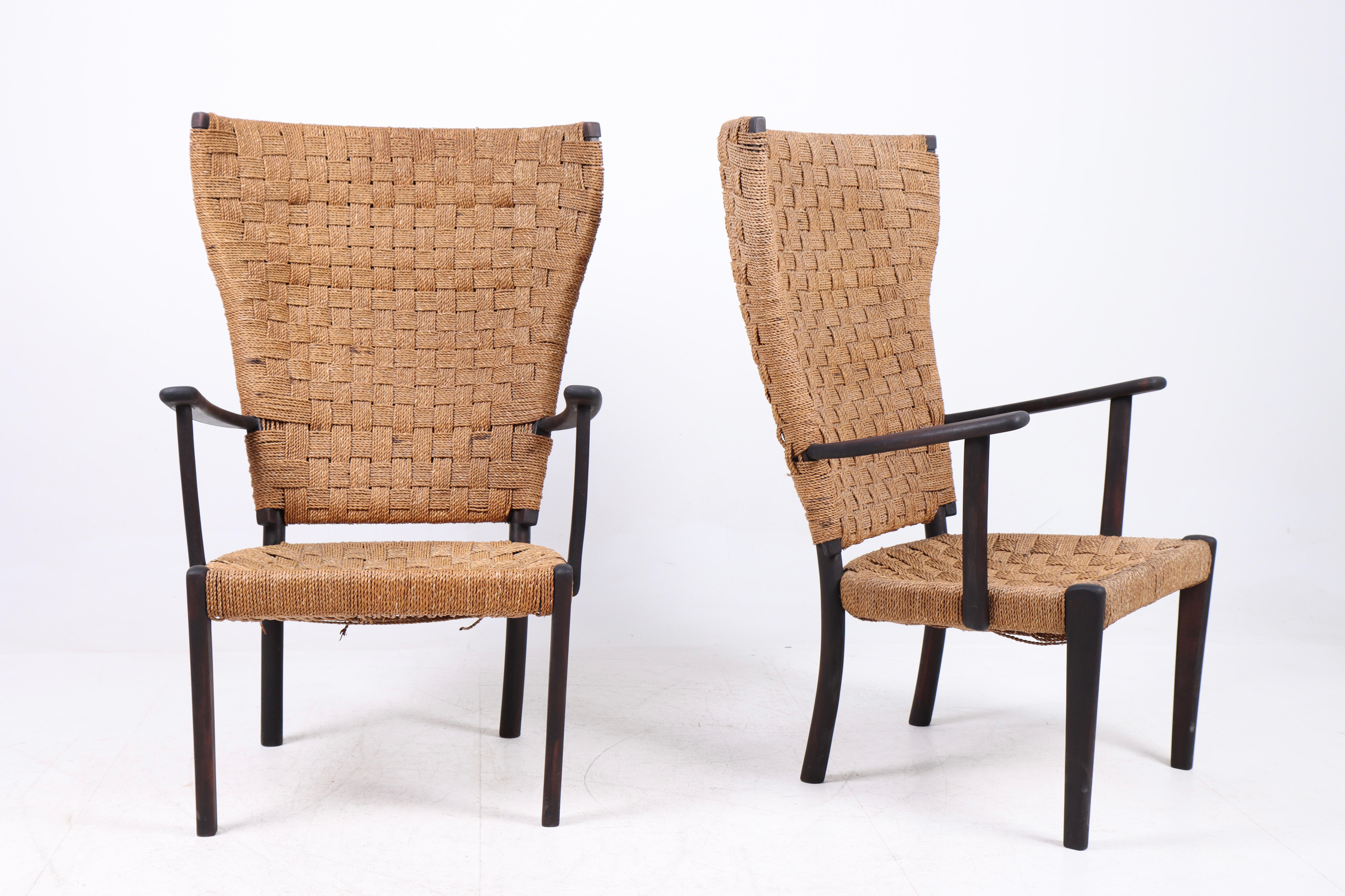 Pair of lounge chairs in beech and seagrass designed and made by cabinetmaker Fritz Hansen 1940s.
