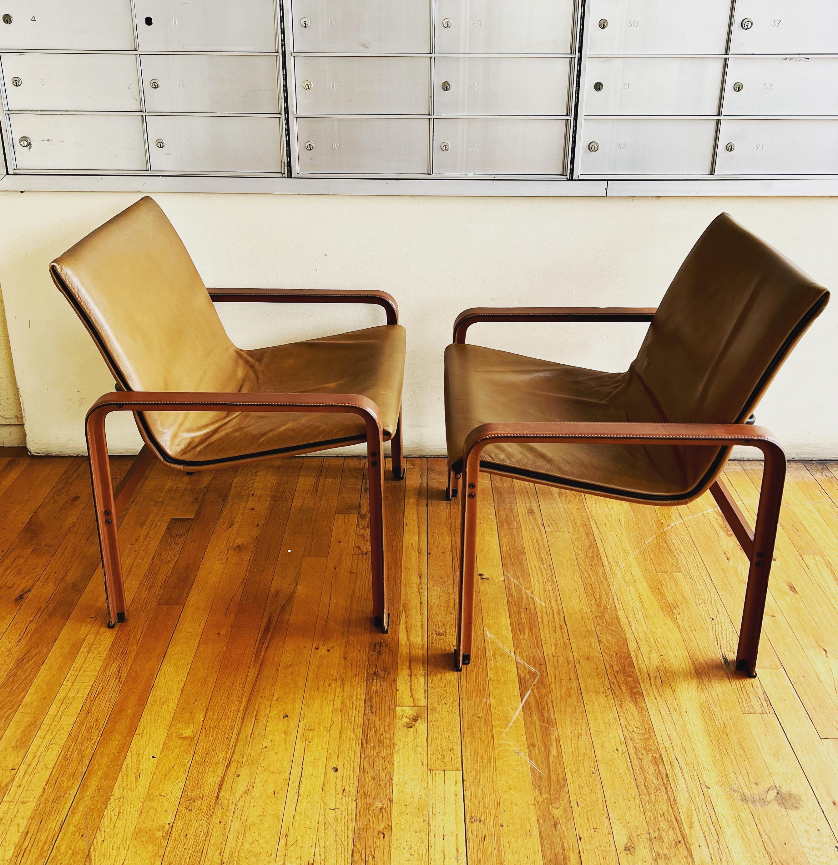 Pair of lounge chairs in patinated leather. Designed and made by Matteo Grassi in Italy in the 1980s. Great original condition.
