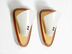 Pair of rare Mid Century expanded red metal wall lamps with plexiglass shades