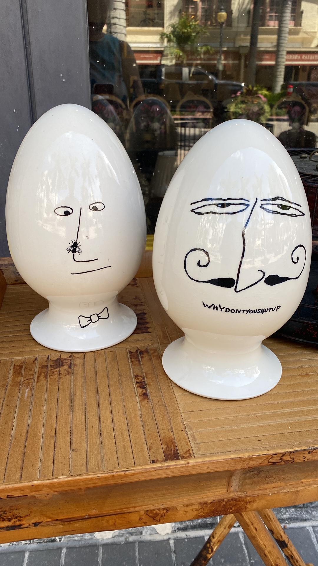This Pair of RARE Mid-Century Modern ceramic EGGHEAD containers where designed and made for PLAYBOY by La Gardo Tackett (American 1911 - 1984) for Schmid Int'l One with a mustachioed face declaring