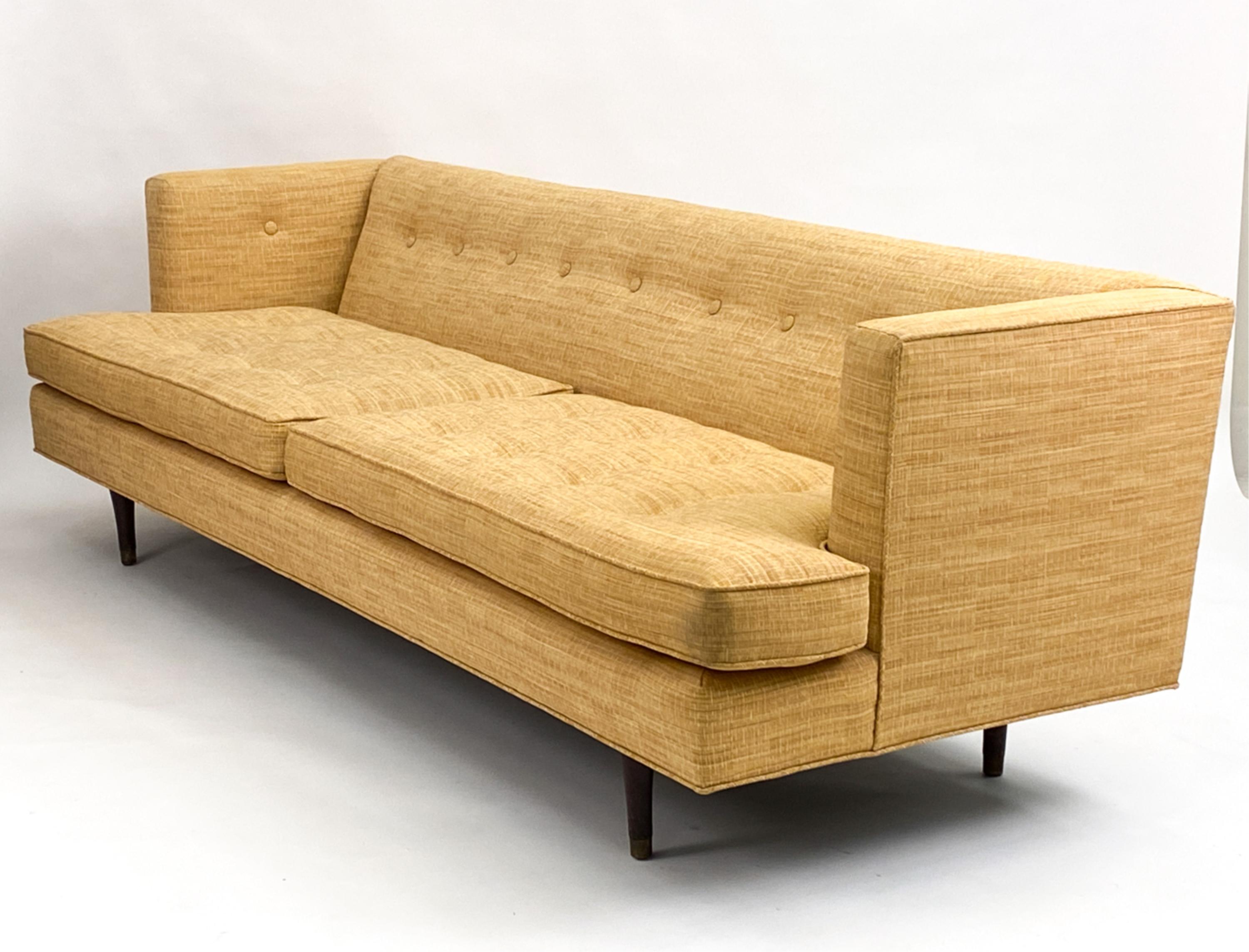 Elevate your living space with this exceptional pair of sofas attributed to iconic mid-century designer Edward Wormley for Dunbar Furniture. Crafted in the 1950s, these sofas embody the era's focus on timeless design and luxurious