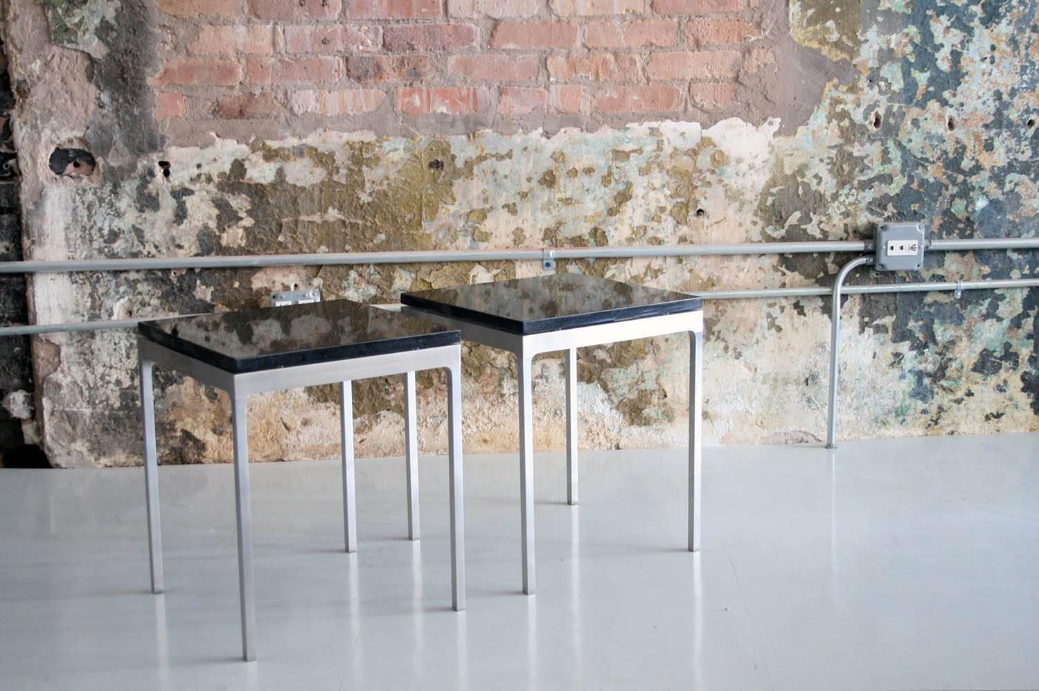 Pair of rare Nico Zagraphos granite and stainless steel side tables in rare small-scale.