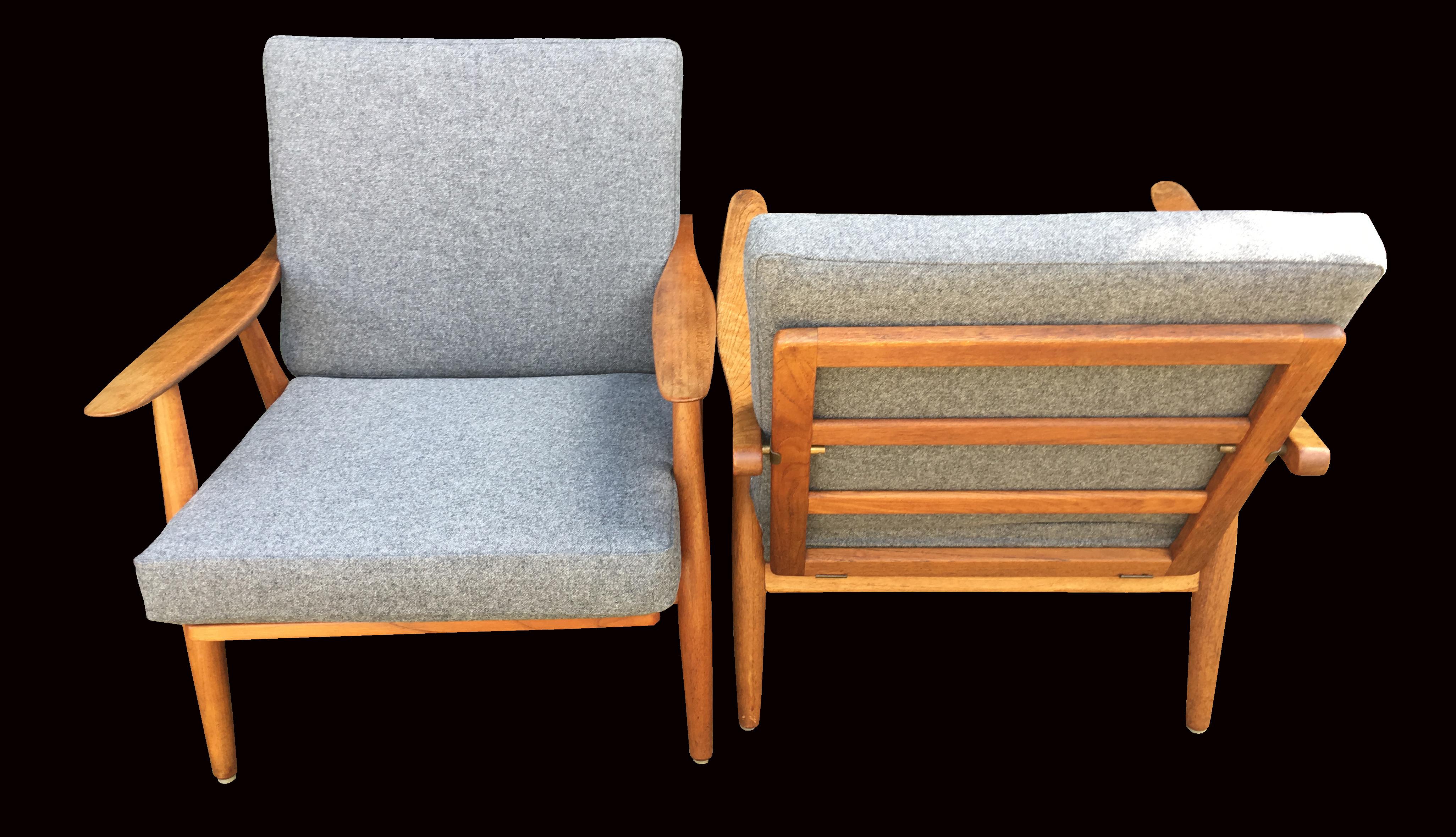 A very good original pair of these scarce model GE270 lounge chairs by Wegner, the frames in very good condition with a nice patina, new webbing and fresh new cushion covers in grey wool fabric.