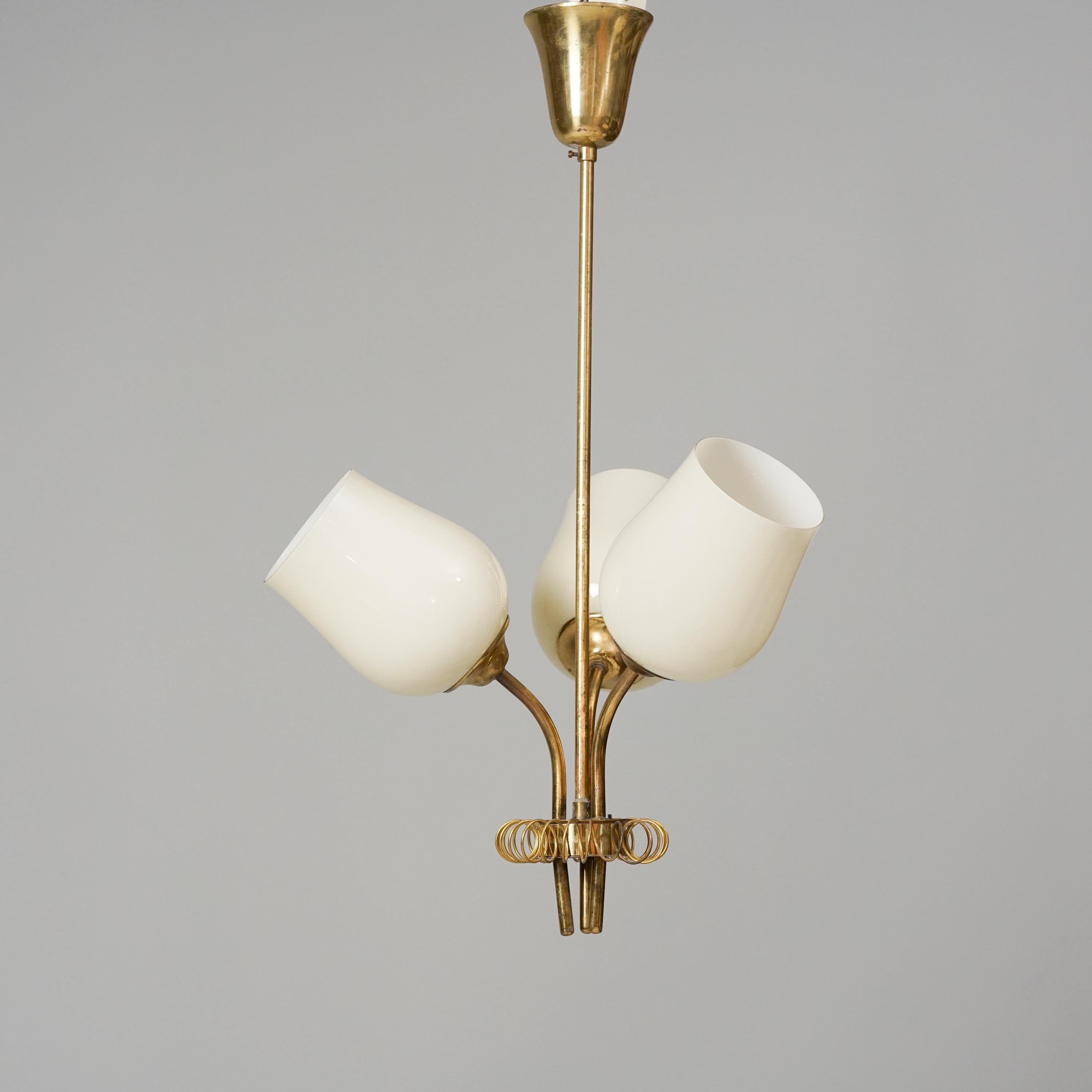 Rare and stunning pair of pendants by Itsu Oy.  Brass and opaline glass, circa 1950s. 

Itsu or Itä-Suomen Sähkö Oy majority of quality Finnish midcentury lights. Most of the models are inspired by Paavo Tynell and Idman/Taito Oy.

!!!The height of