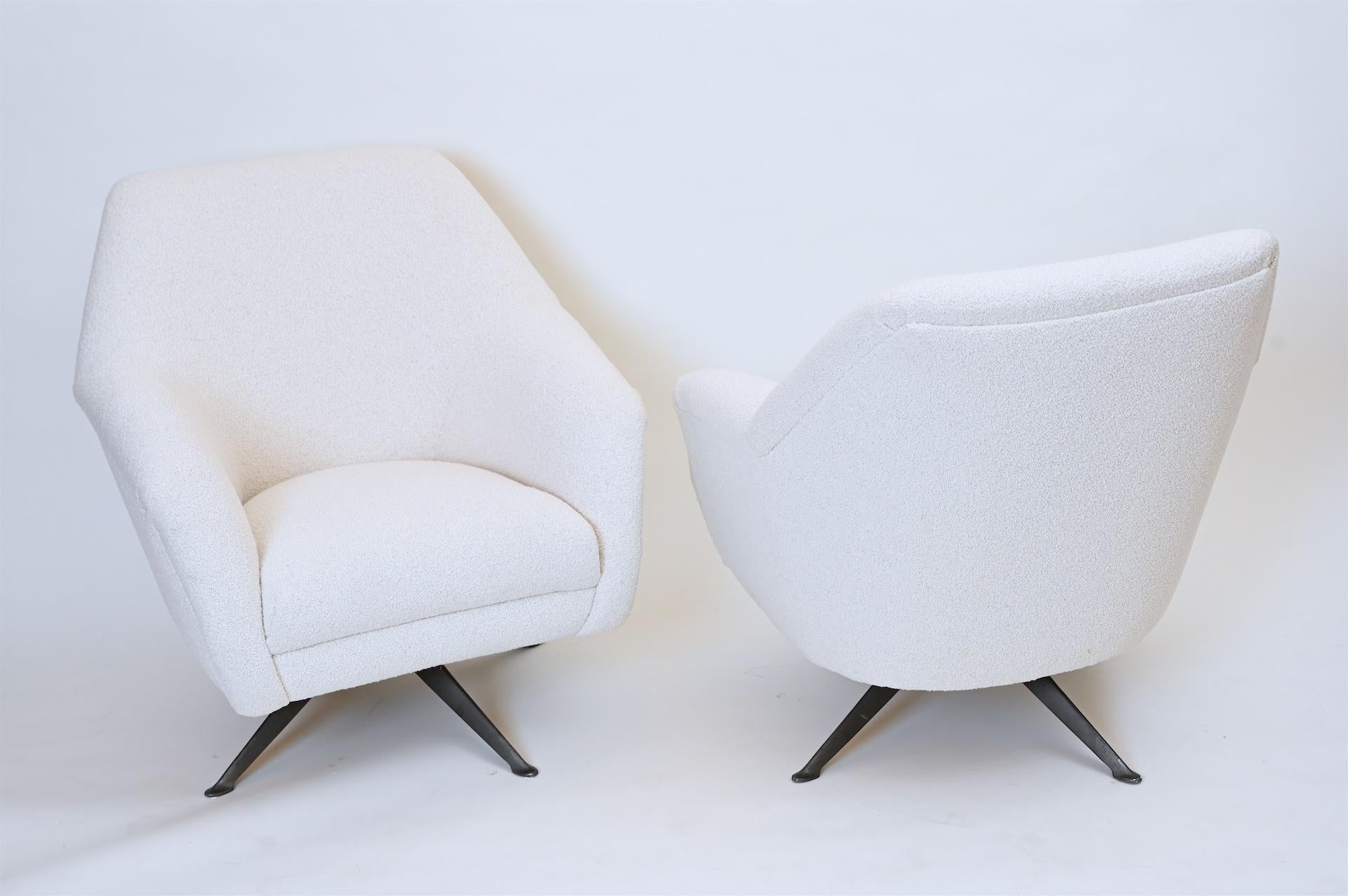 These are original and rare 1950s Borsani chairs. 

A design Classic. 

These have been reupholstered in a cotton white boucle

Prada has recently commissioned a re-edited model for their stores.
  
