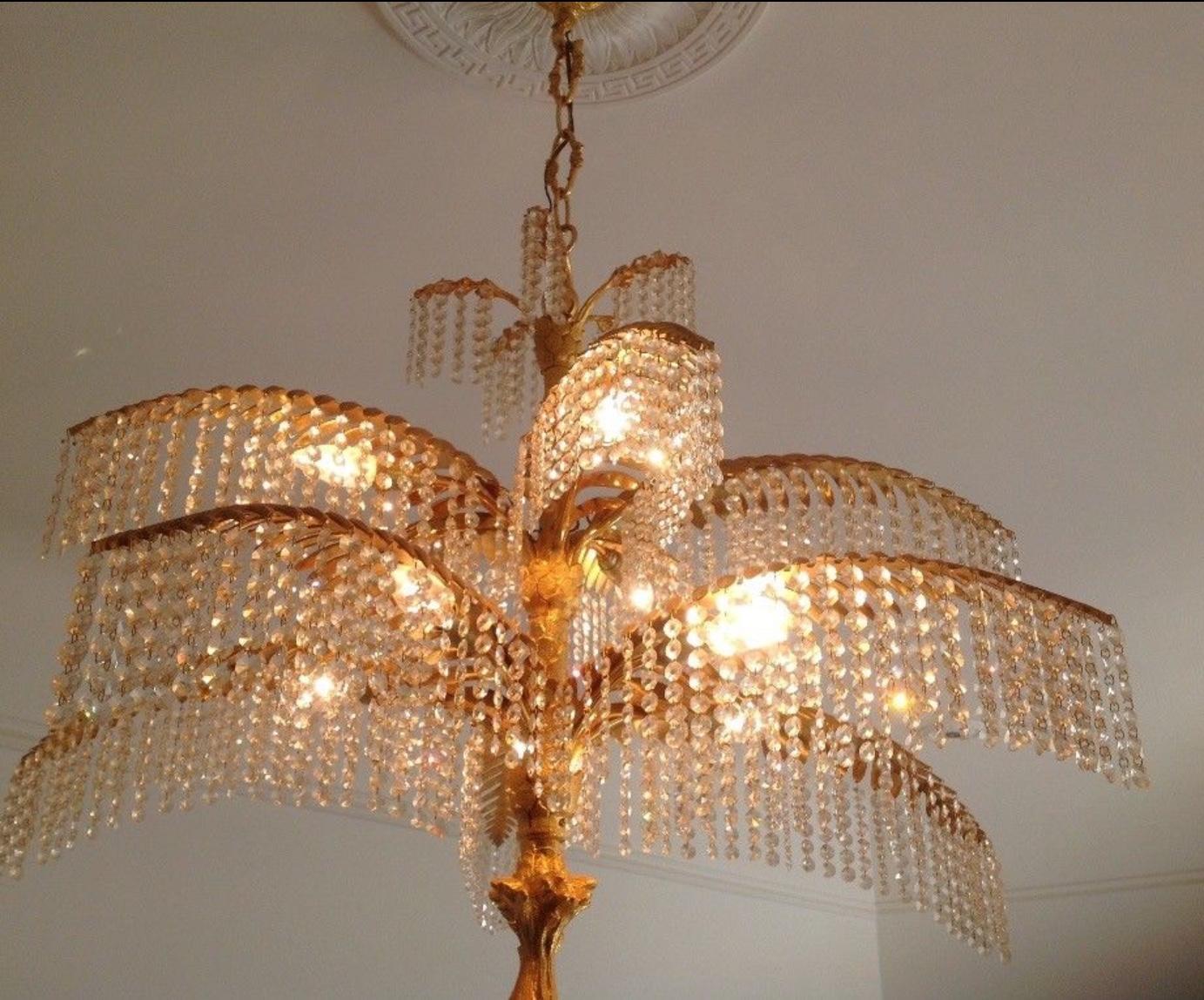 Amazing and large gilt bronze and crystal palm tree chandelier, prop. Bakalowits, circa 1970s.
Made of 24 Karat gilt and solid bronze frame and cut crystal.
Socket: e14 (Edison) for standard screw bulbs.
Excellent condition.