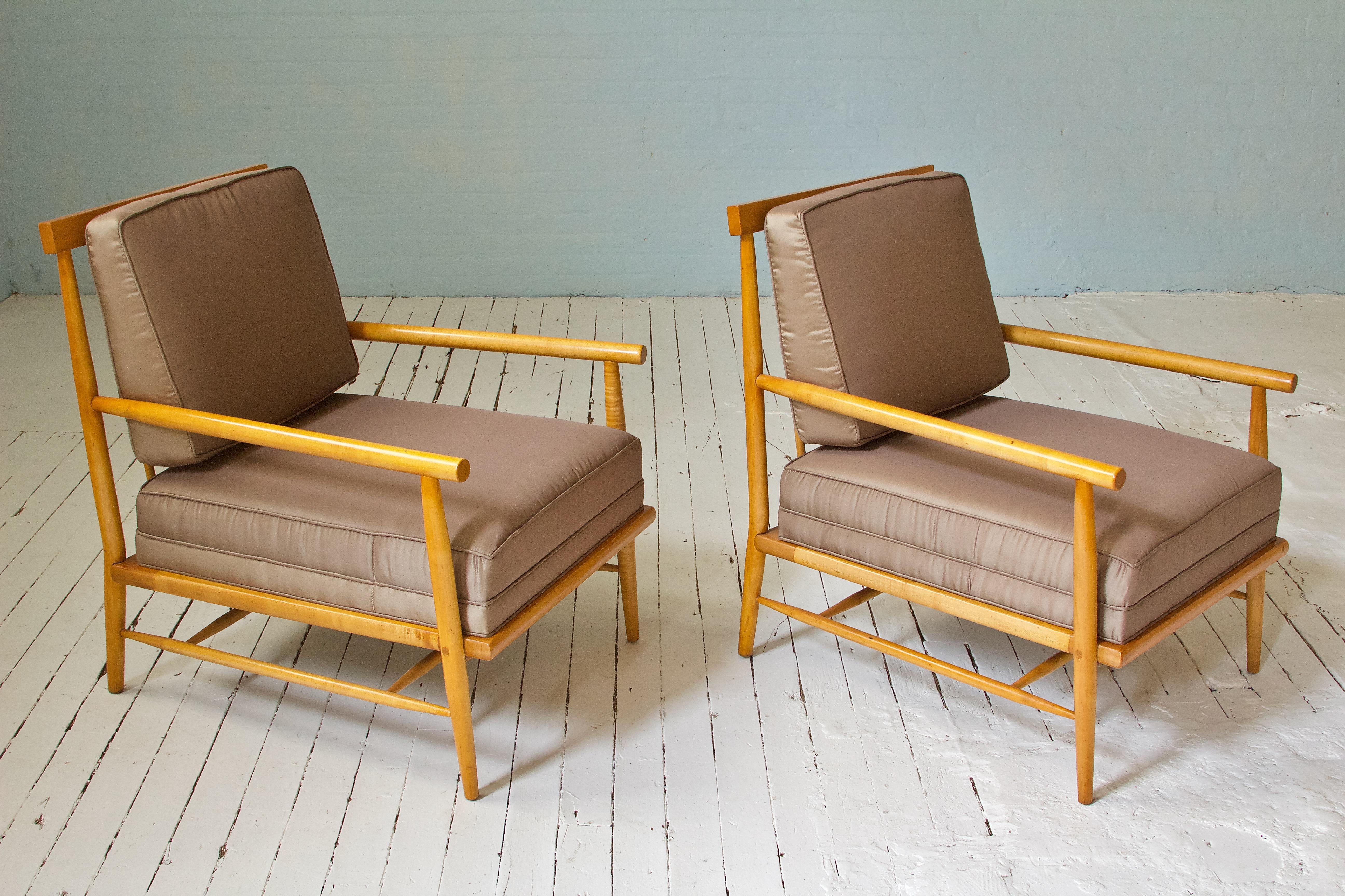 Great pair of rare lounge chairs designed by an American titan of 20th century furniture design--Paul McCobb. This pair--in turned figured maple--was produced by O'Hearn in Gardner, Mass. as part of McCobb's very successful 