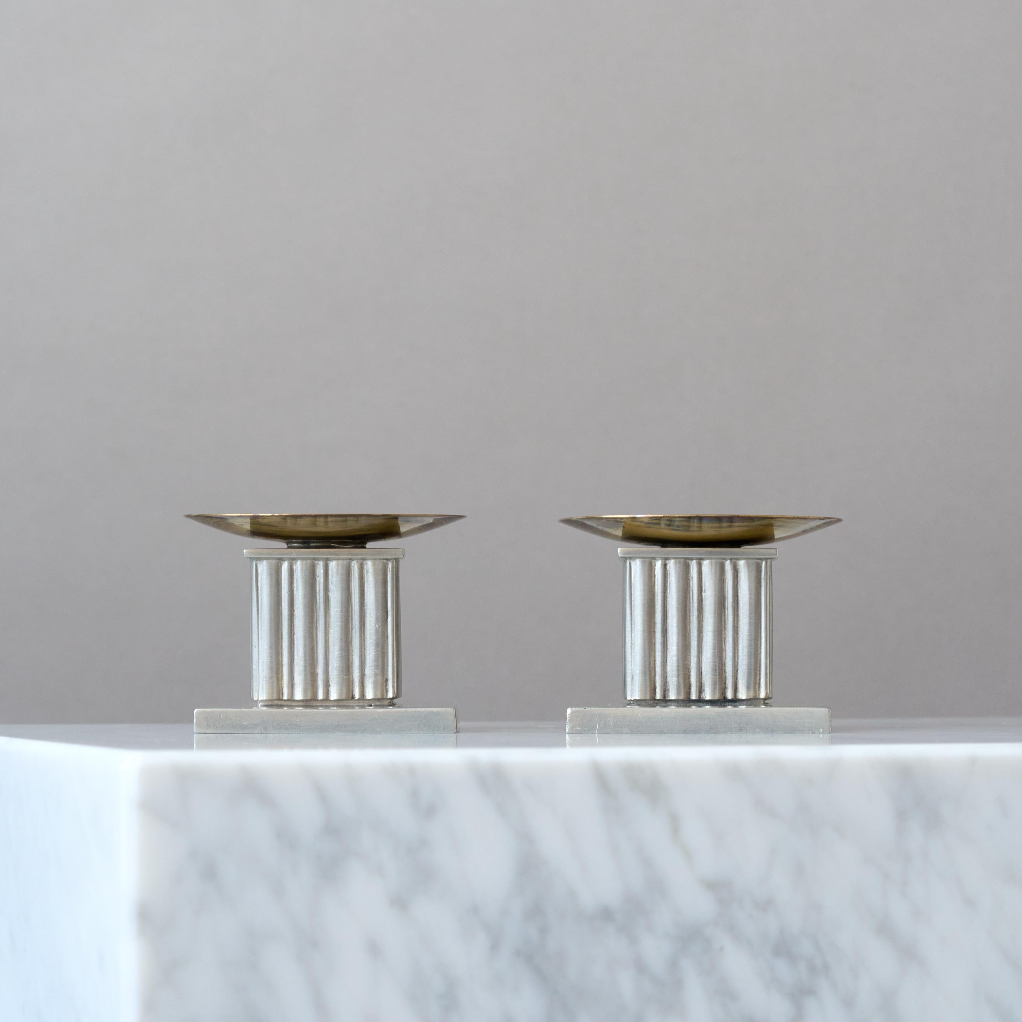 Pair of rare Art Deco / Swedish Grace pewter and brass candlesticks with amazing patina. 
Made by GAB Guldsmedsaktiebolaget, Sweden, 1930s.  

Good condition, some light scratches and scuffs.
Stamped with makers mark and 'N8' for