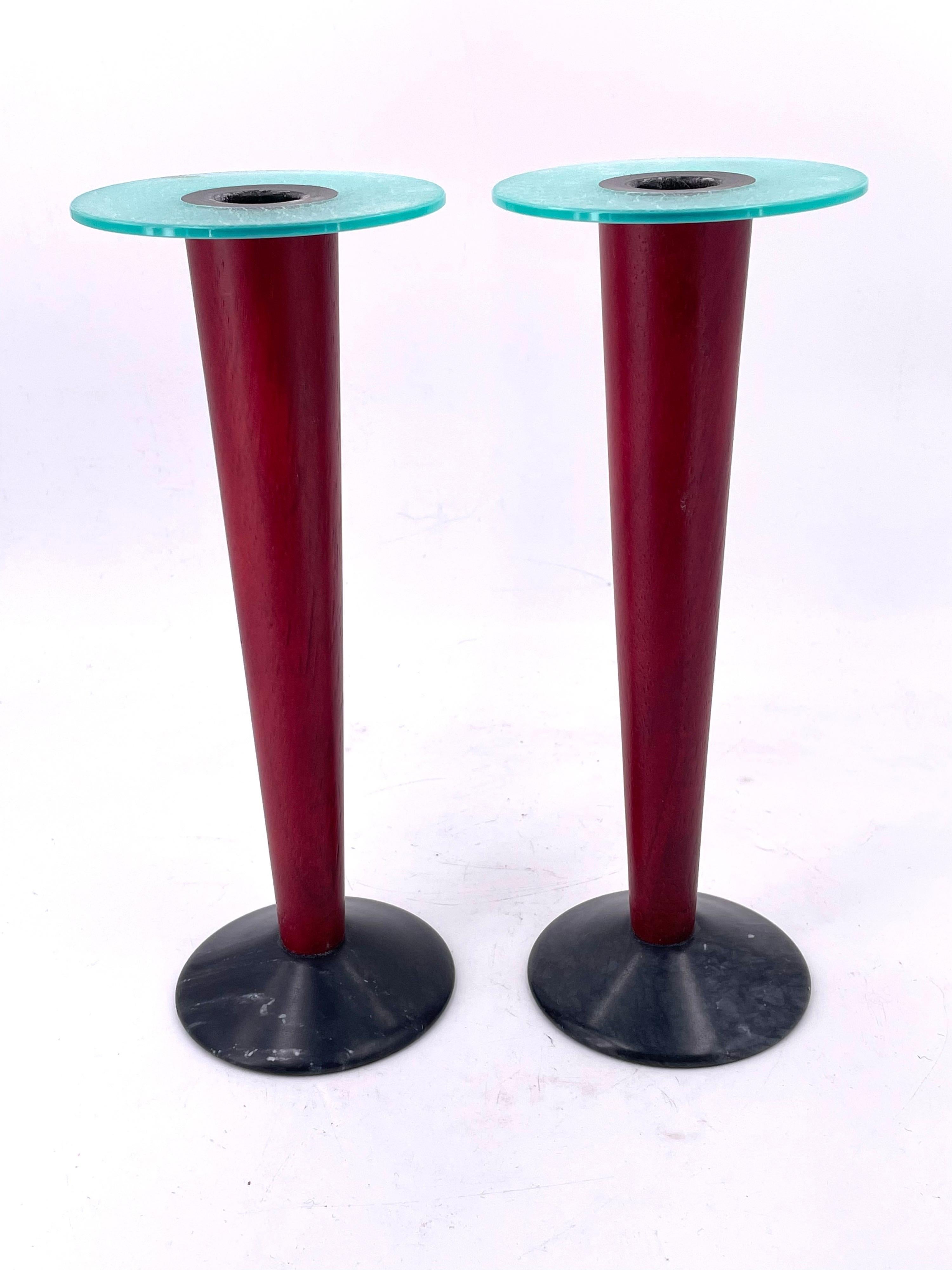 Rare pair of candlesticks in wood centers with frosted crackle plastic ring 
, sitting on
 stone, circa 1980s.