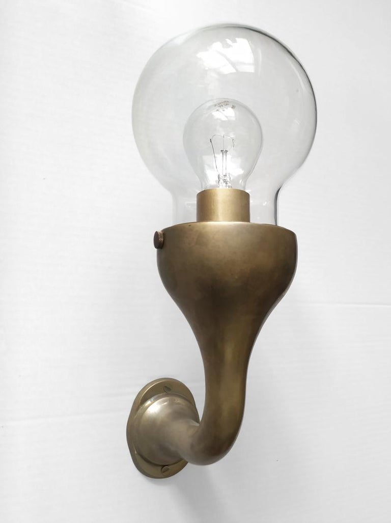Pair of beautiful brass and blown glass wall lamps.
Germany, 1970s.
Lamp sockets: 1x E27 (US: E26).