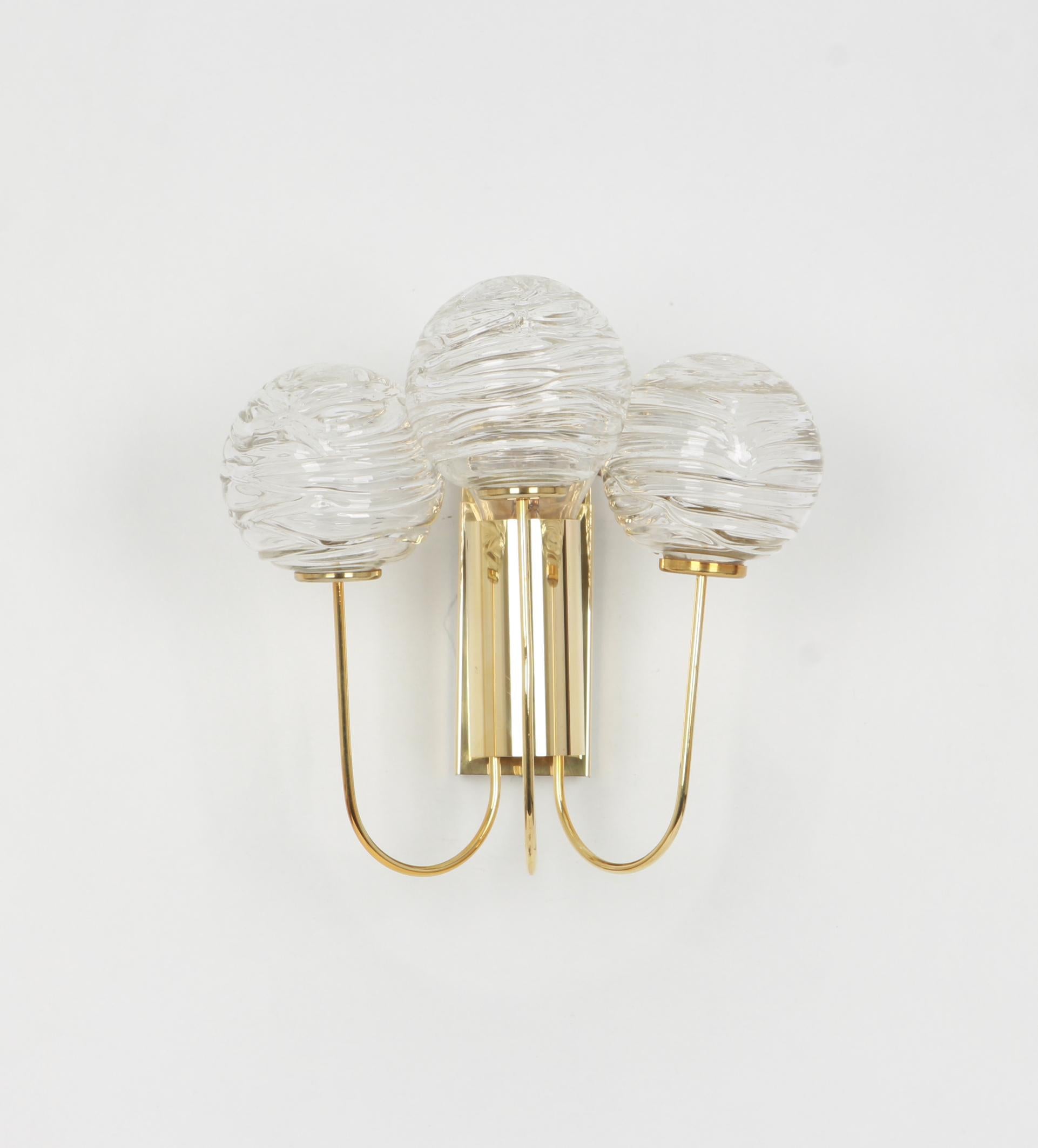 Wonderful pair of midcentury rare wall sconces with Murano glass balls, made by Doria Leuchten, Germany, manufactured, circa 1960-1969.


High quality and in very good condition. Cleaned, well-wired and ready to use. 

Each sconce requires 1 x
