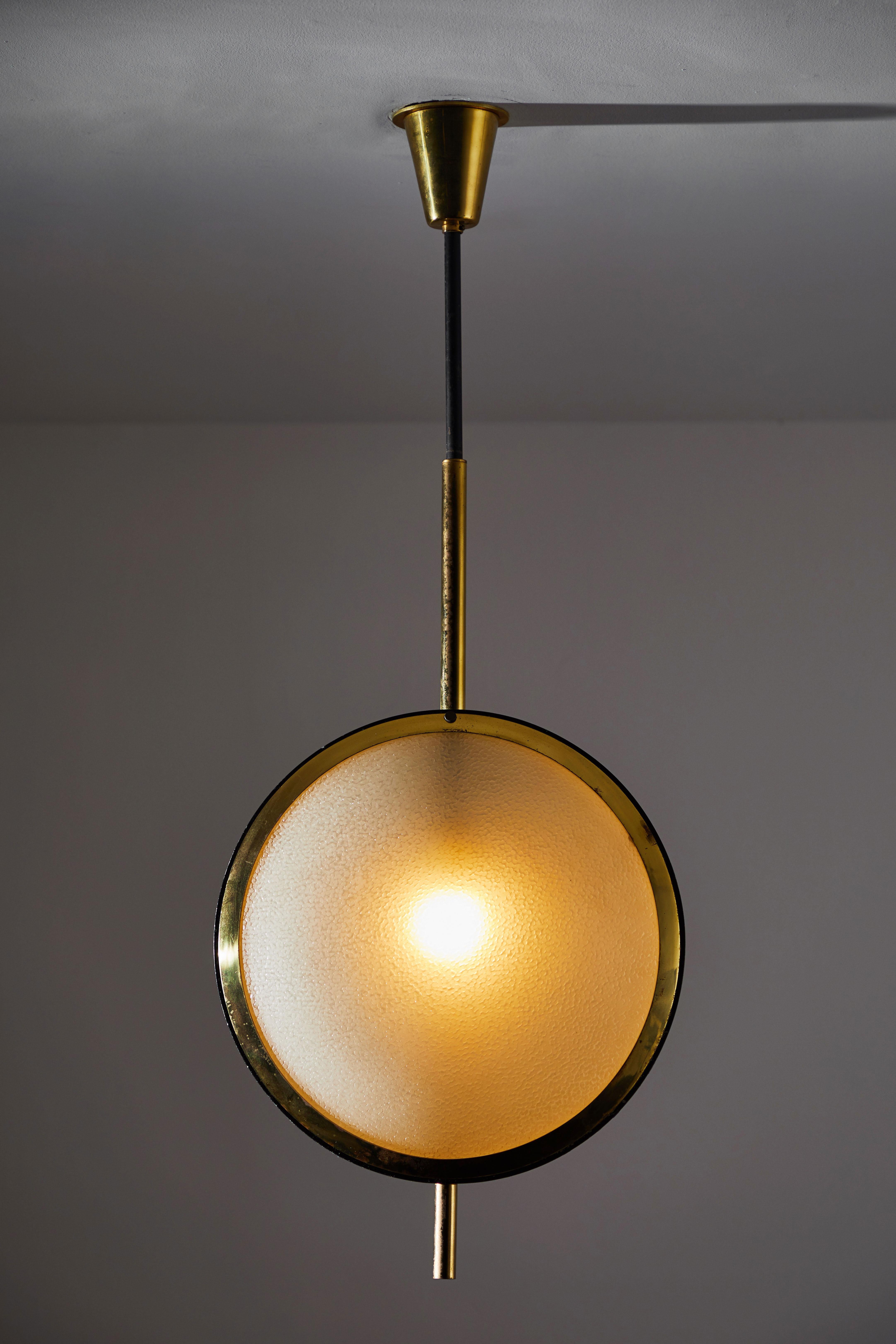 Two rare Stilnovo pendants. Manufactured in Italy, circa 1950s. Brass and textured glass. Rewired for US junction boxes. Original canopy with custom backplate. Each light takes one E26 60w maximum bulb.
TWO AVAILABLE, priced individually