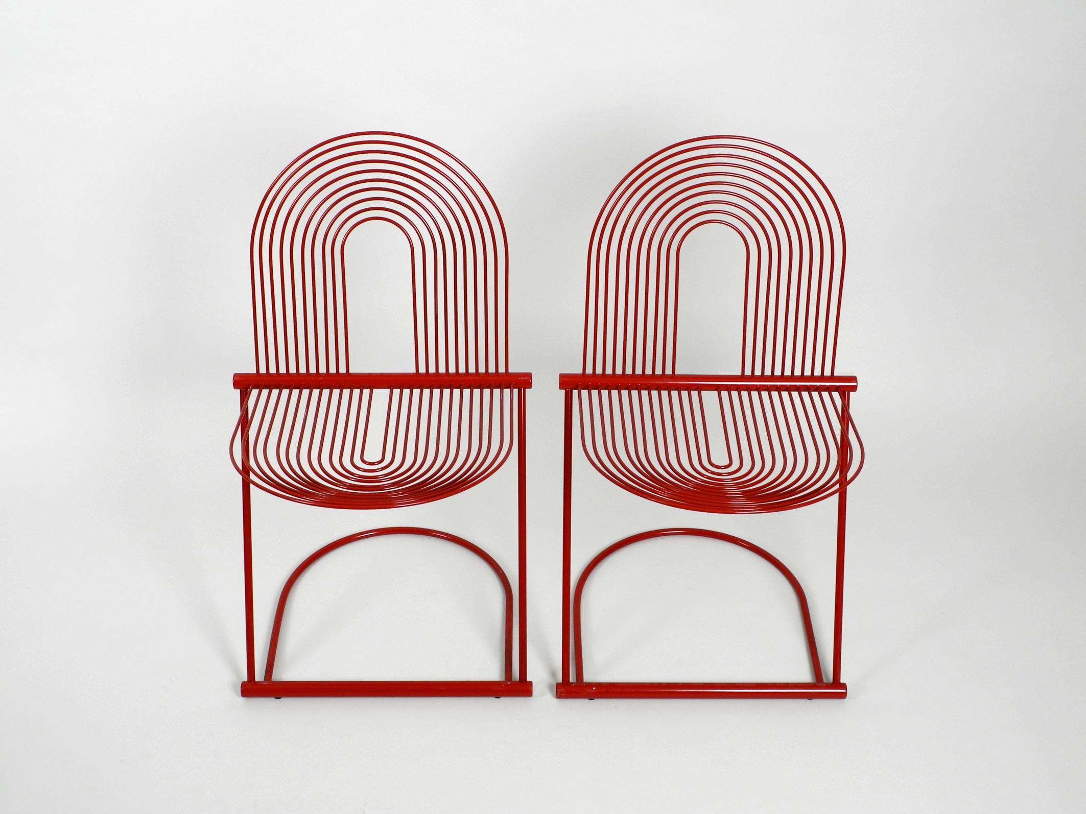 Pair of very rare red swing chairs by Jutta and Herbert Ohl.
From Rosenthal Studio Line. Designed 1982. Made in Germany.
The cantilever chairs are made of red painted spring steel.
In 1982 the designer couple Herbert and Jutta Ohl created the